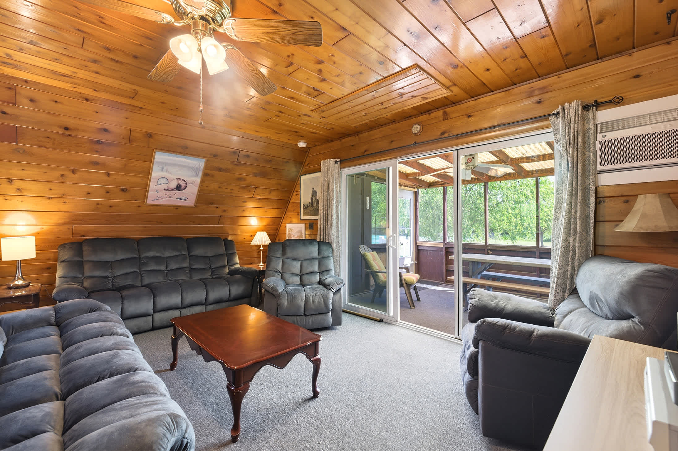 Open living area connected to the screened porch makes group stays more comfortable.