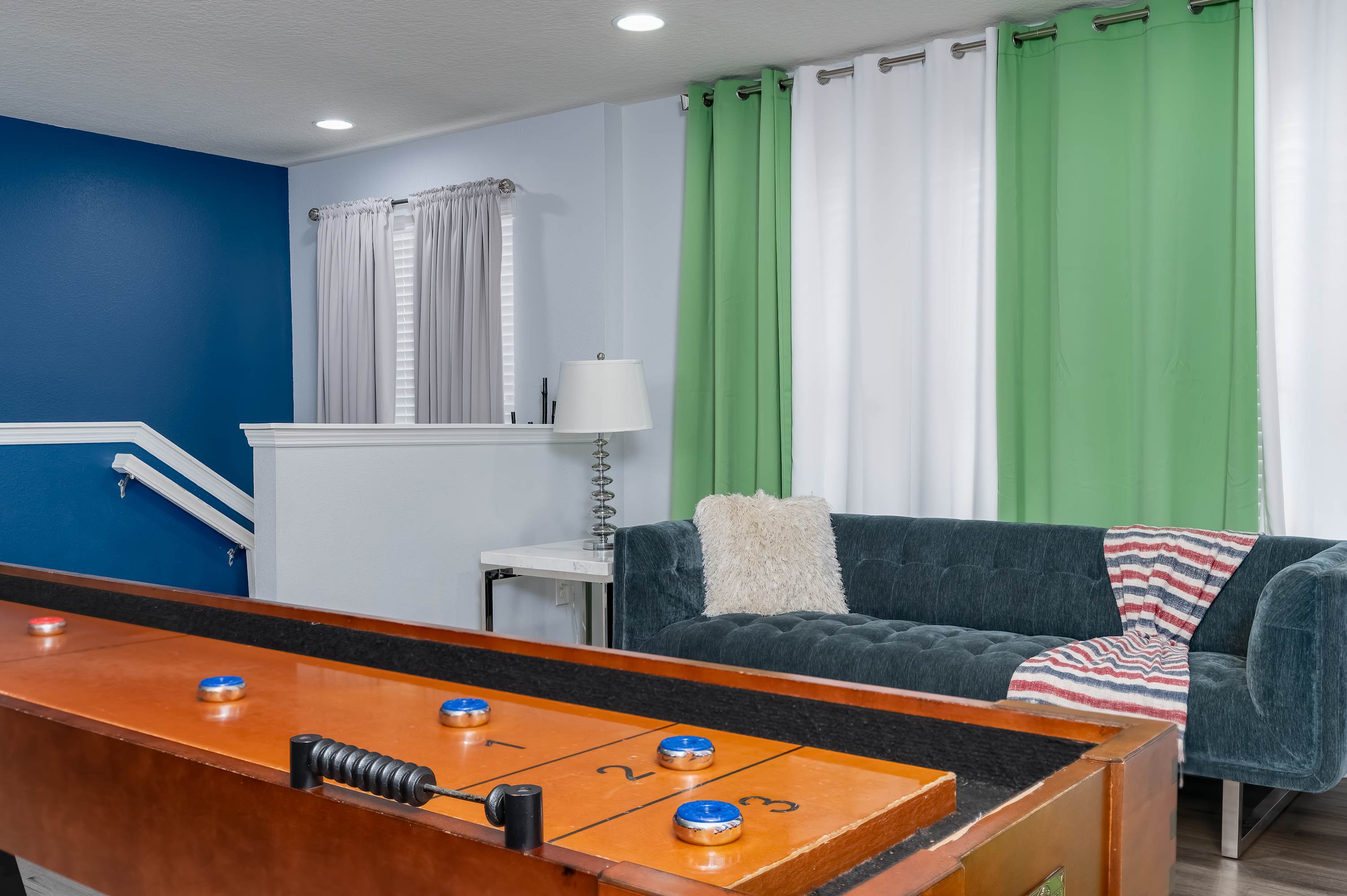 Game room w/ foosball table & lounge seating — hours of fun for all ages.
