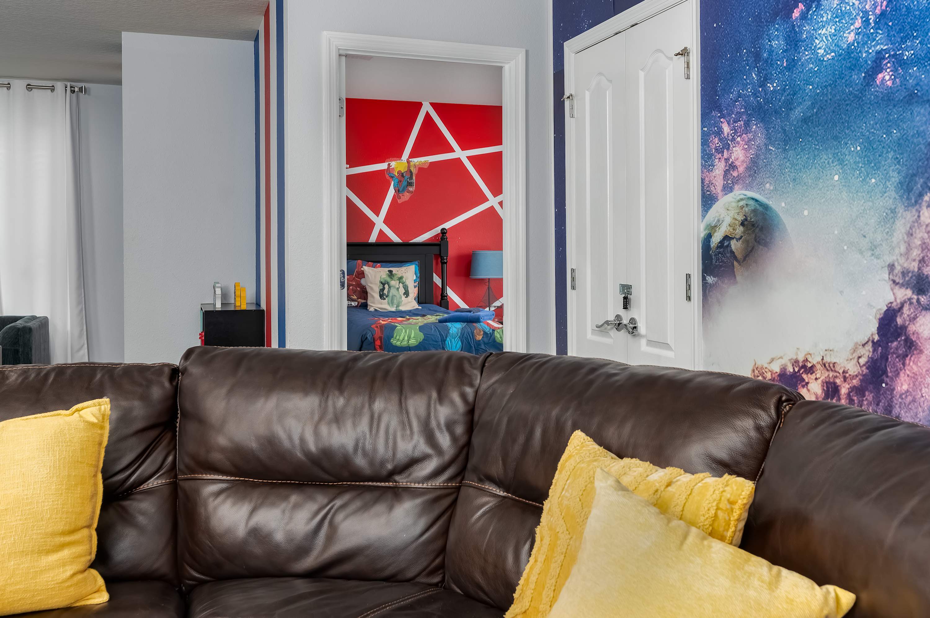 Cozy living area w/ leather sofas & pops of yellow — stylish & inviting.