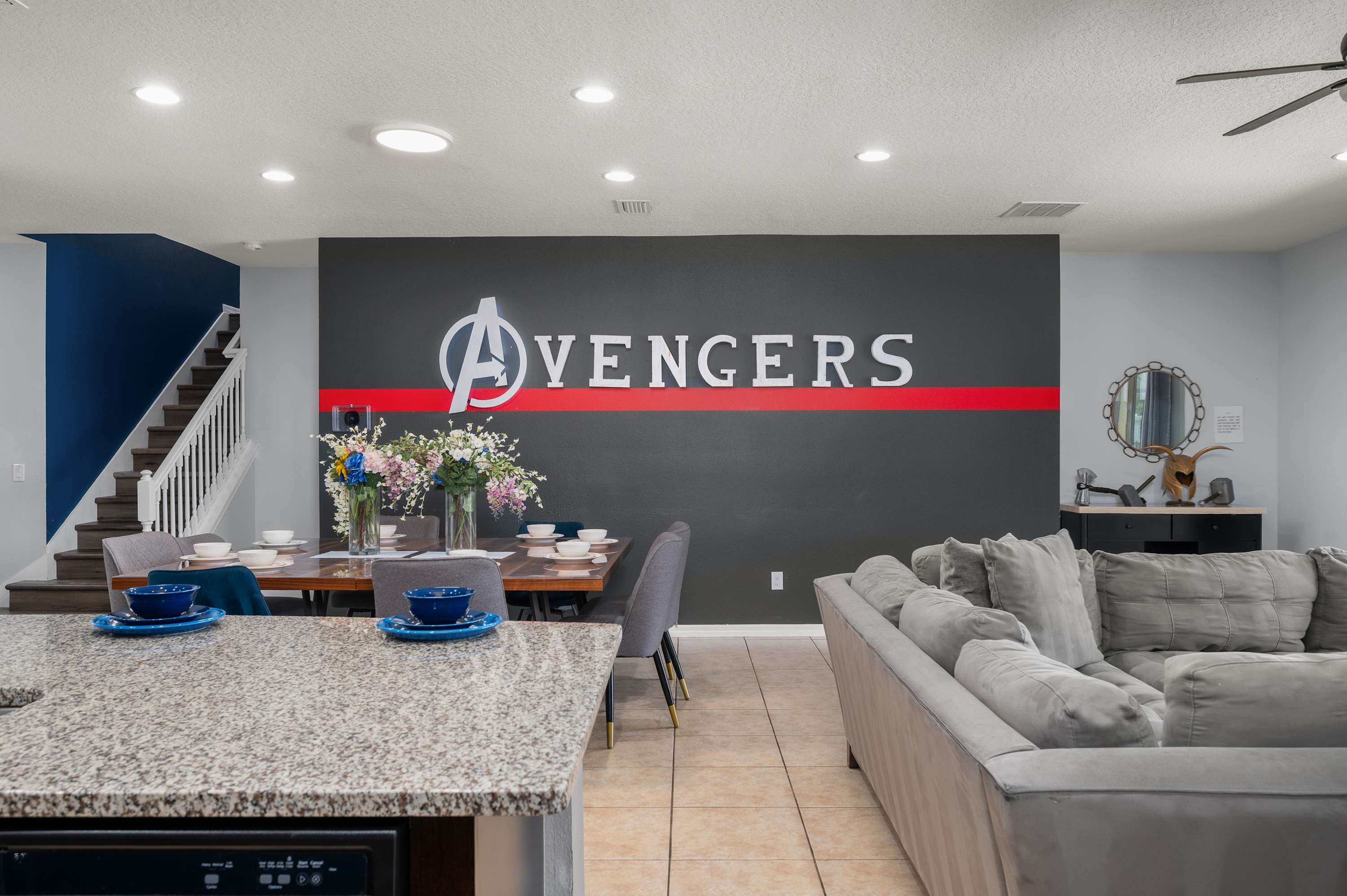 Avengers living room w/ bold wall art & open layout — great for lounging between adventures.