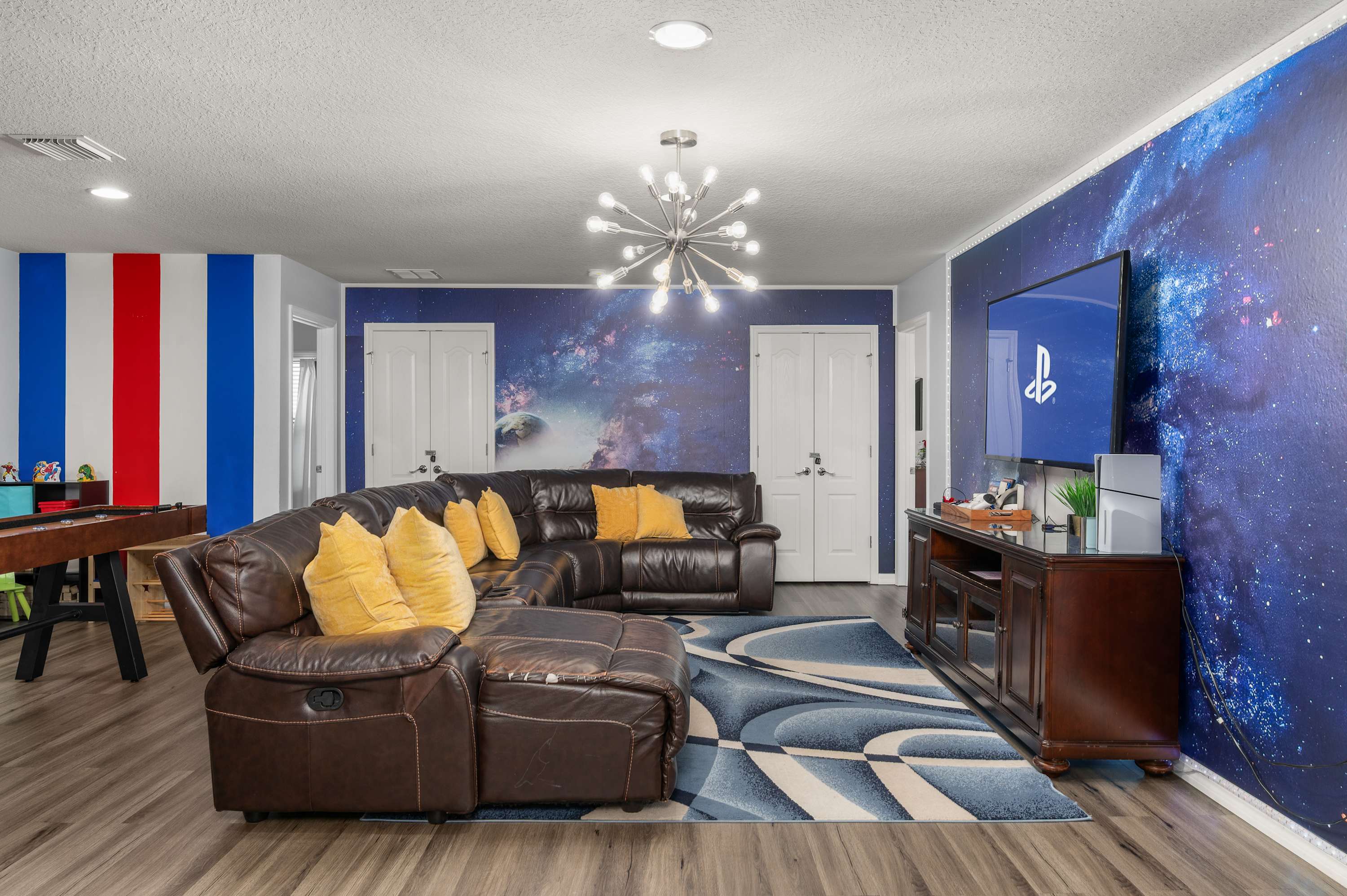 Fun living area w/ bold murals & plenty of seating for movie nights or game time.