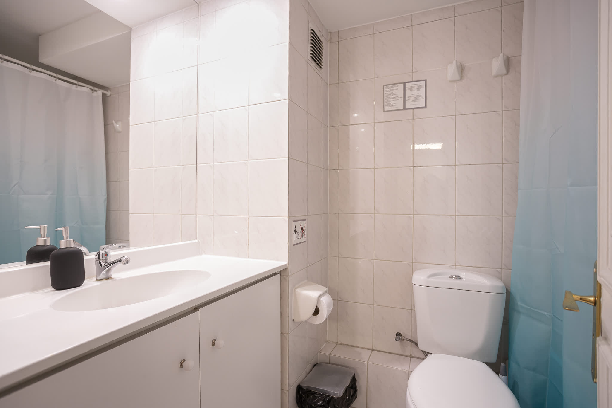 Bright and clean bathroom with modern fixtures, perfect for a refreshing start to your day.