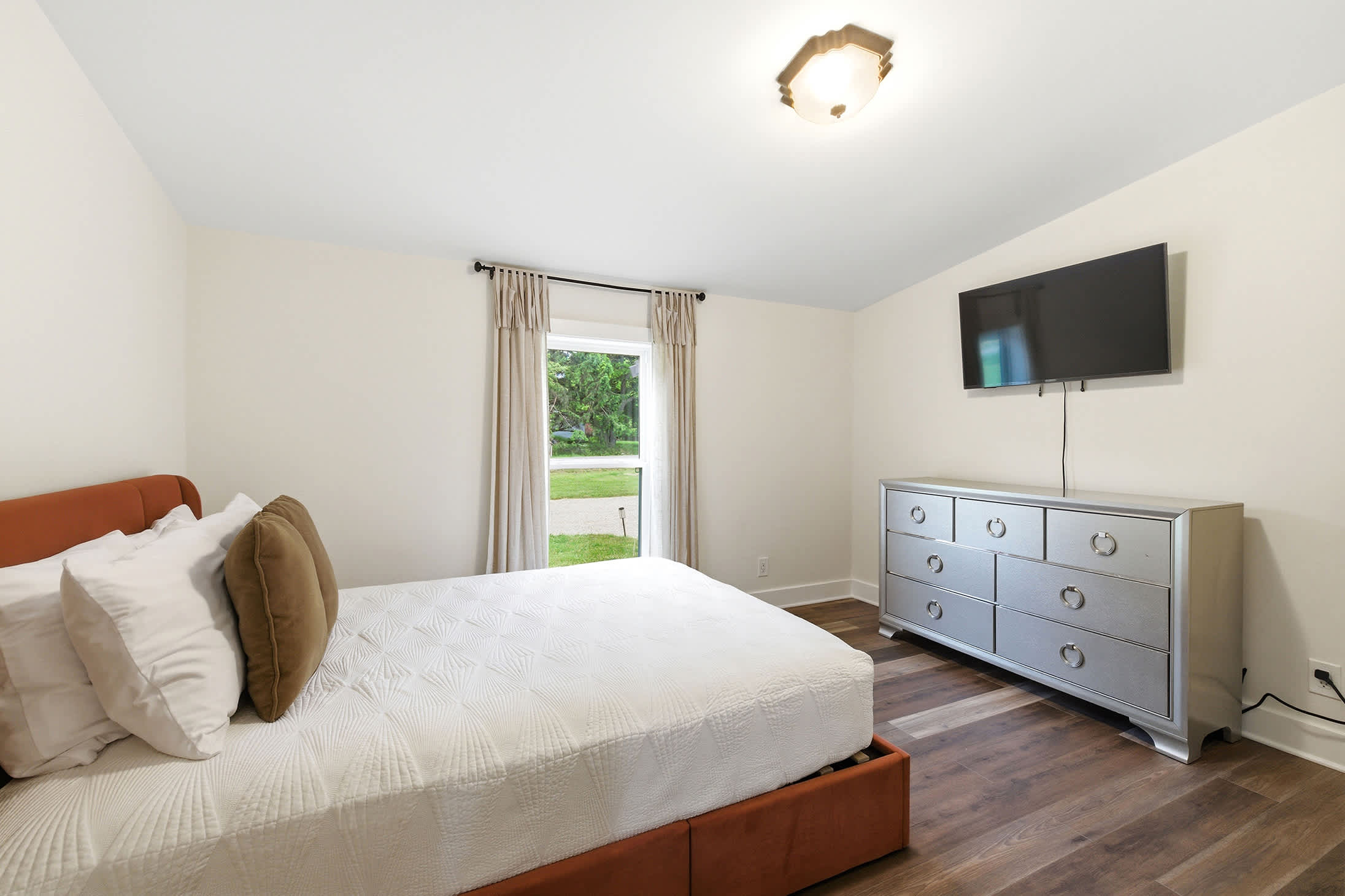 A bright guest bedroom with space to unpack and settle in.