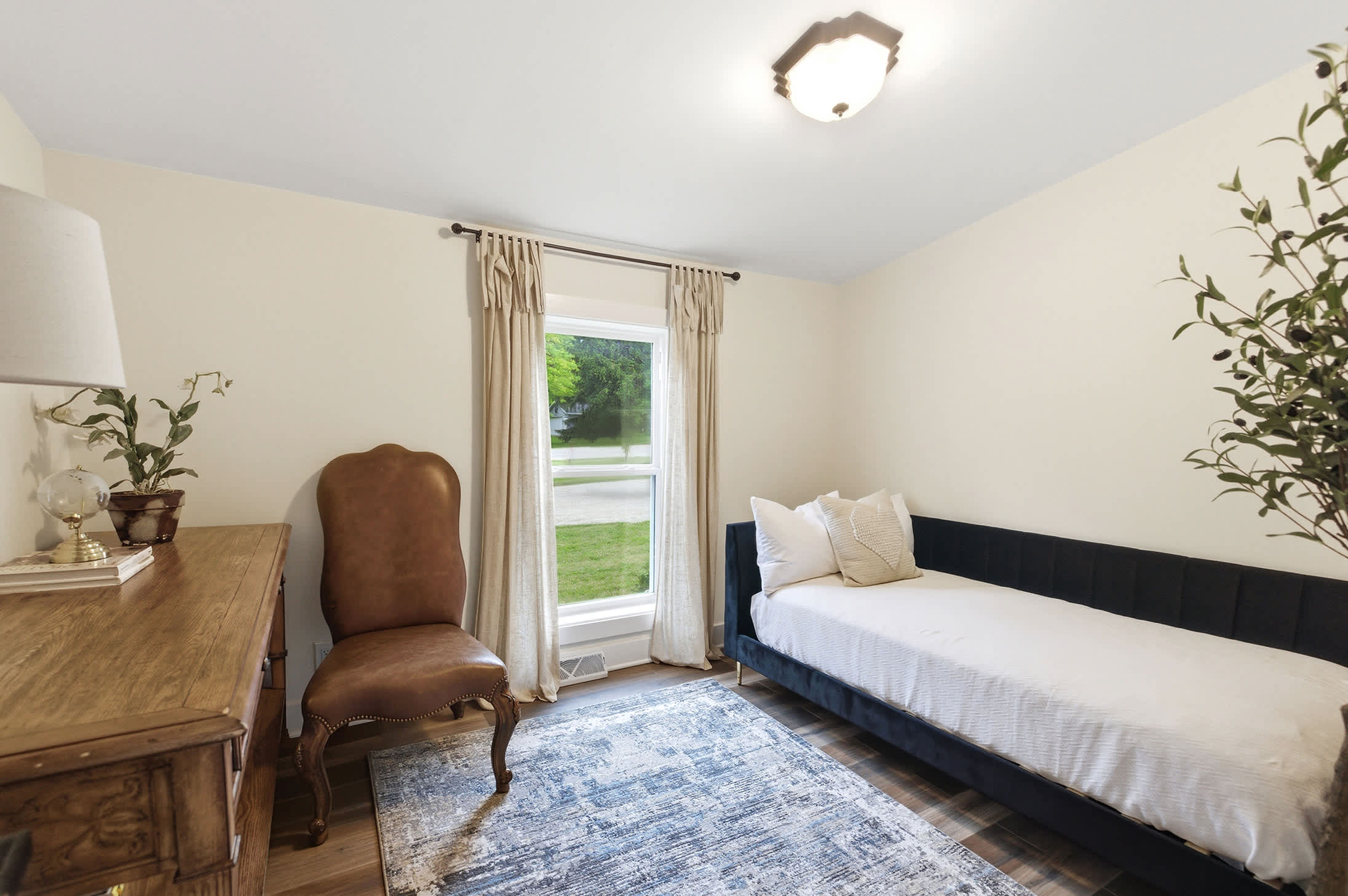 Bedroom 5 offers a quiet dedicated desk and a comfortable daybed.