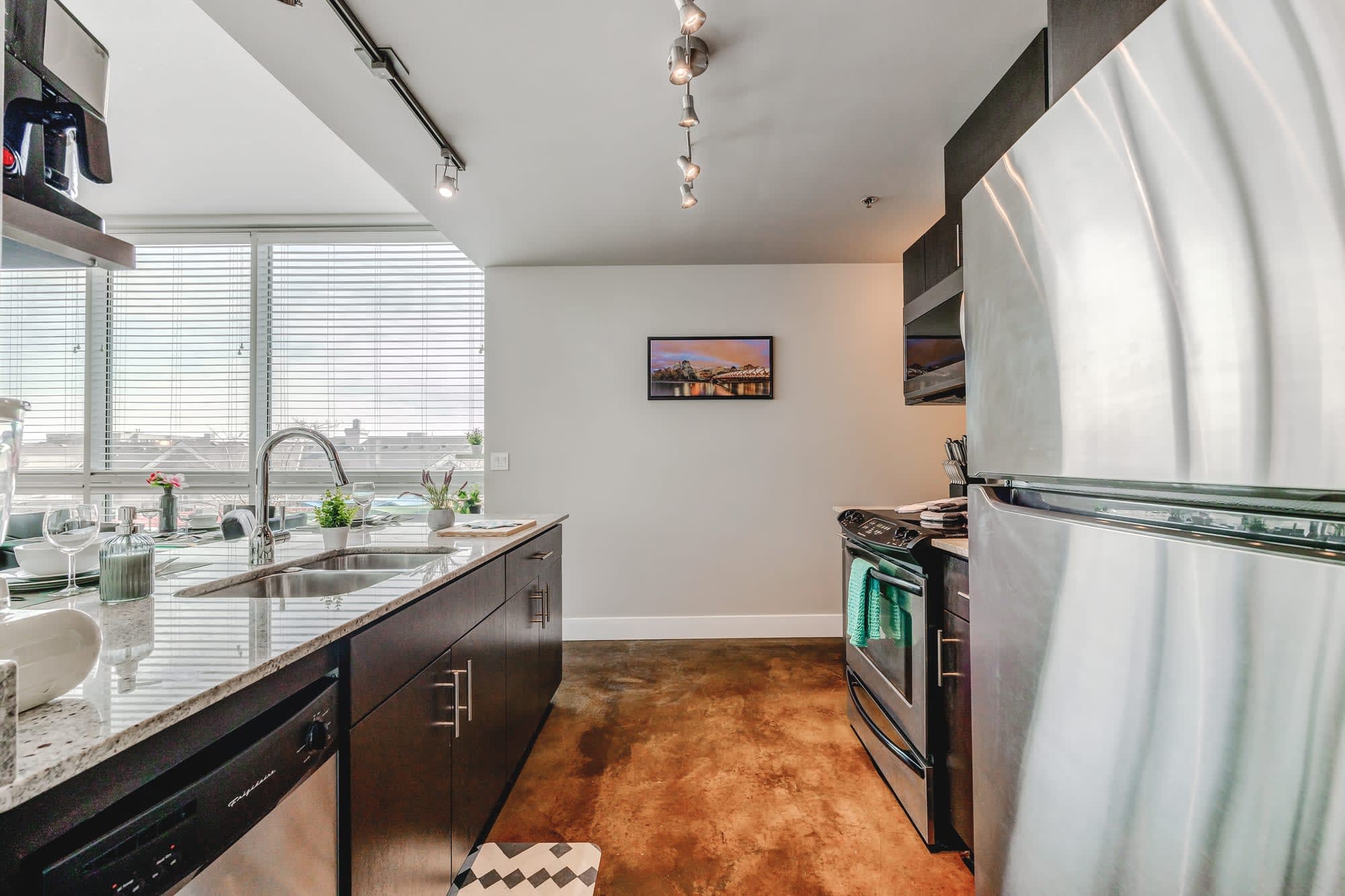 Kitchen includes a dishwasher, and new stainless steel appliances
