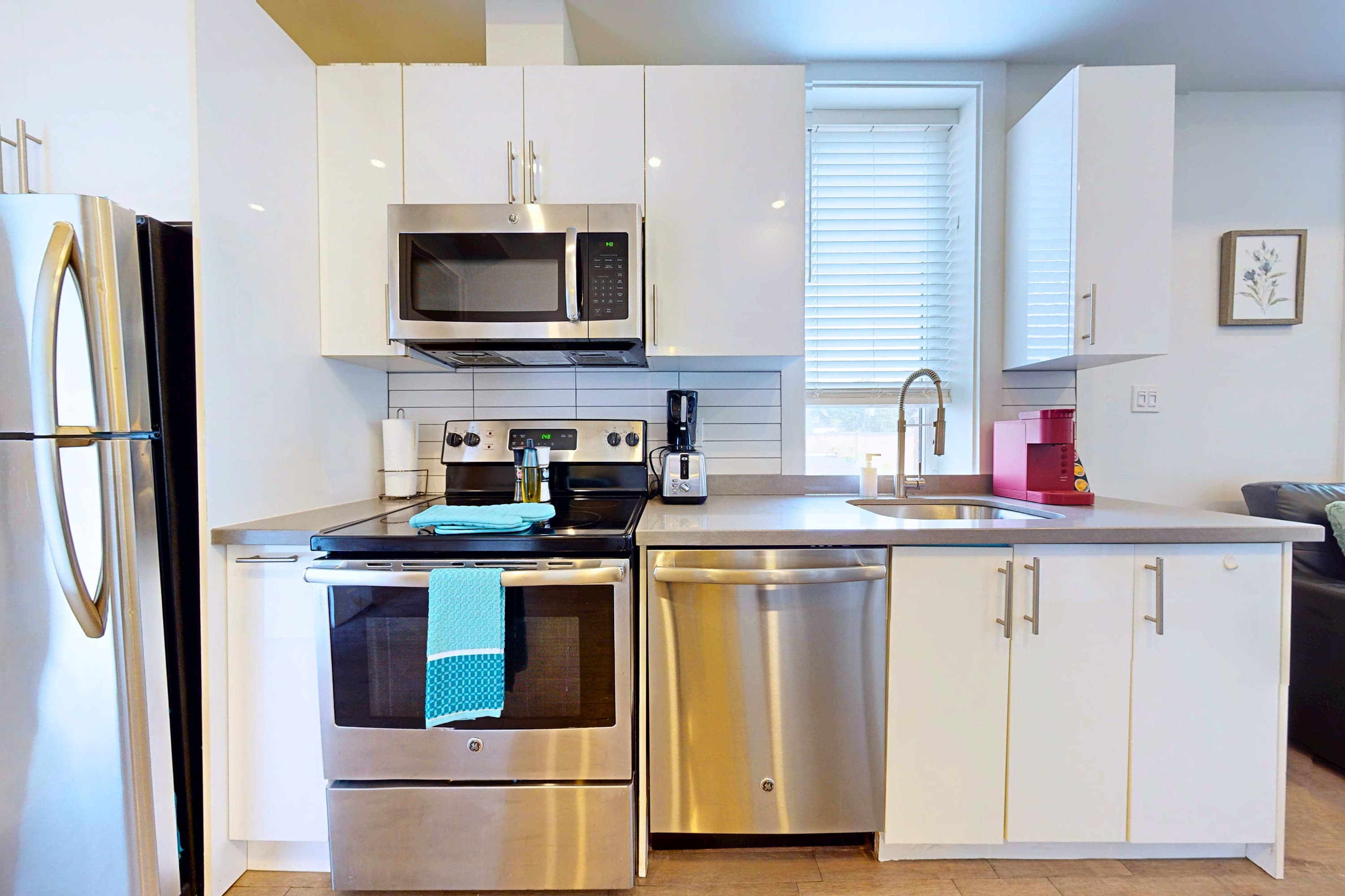 Open-layout kitchen with silver appliances