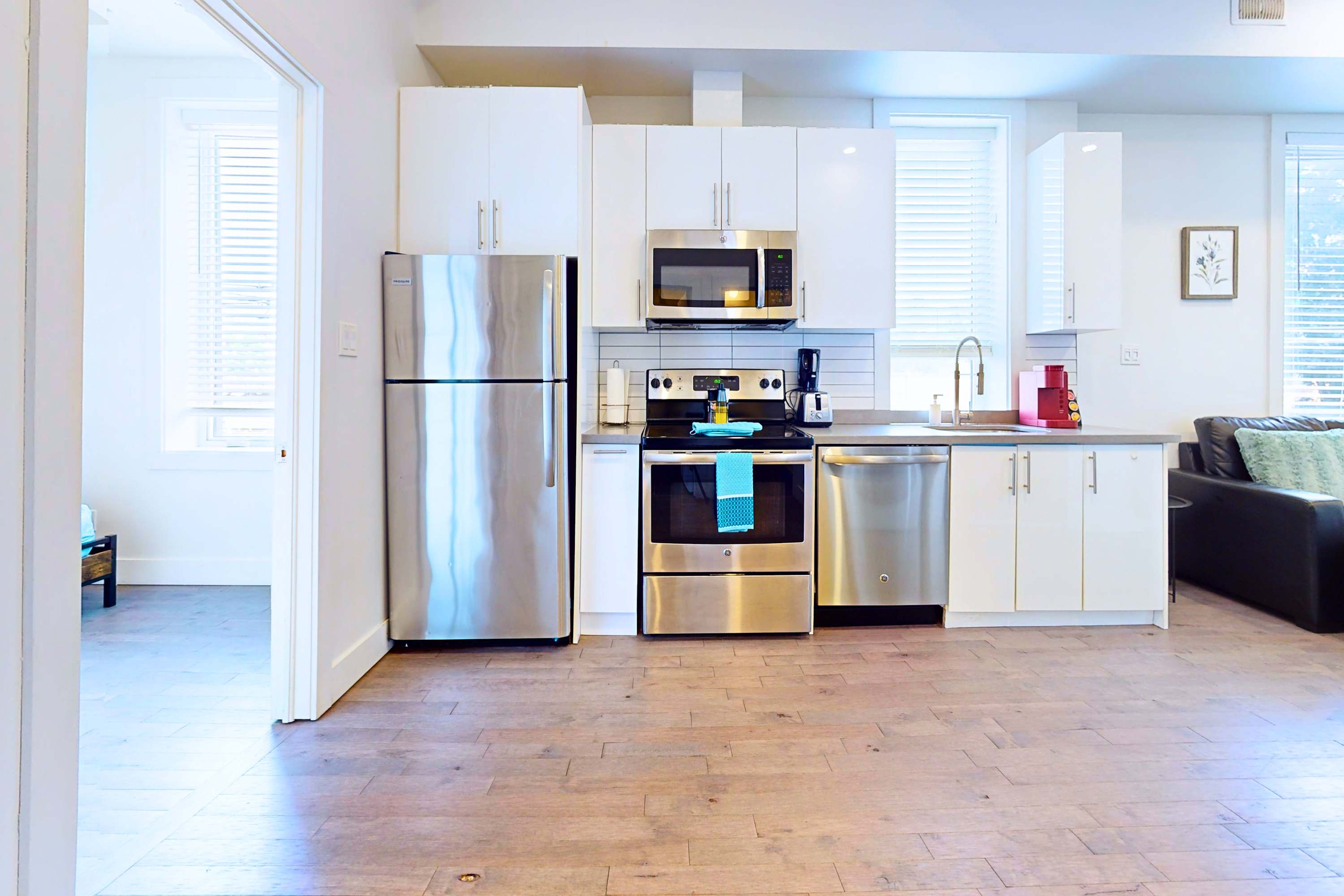 Open-layout kitchen with silver appliances