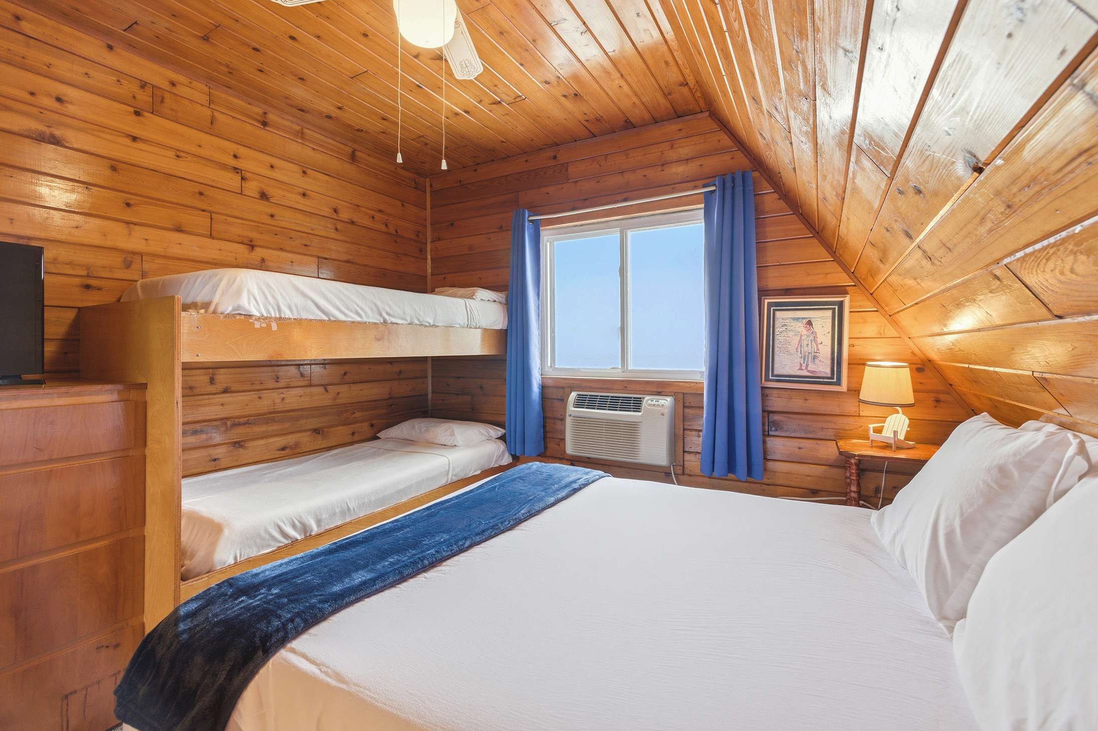 Designed for family vacations, this bedroom offers room for multiple guests.