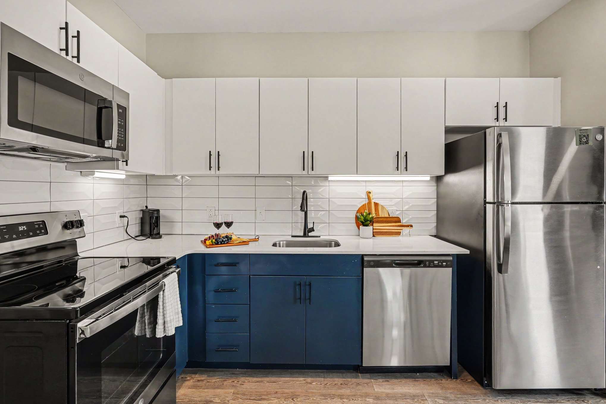 This modern kitchen features sleek stainless steel appliances, dining area for 6, and all the essentials you need for a comfortable and convenient stay. Open concept to living area.