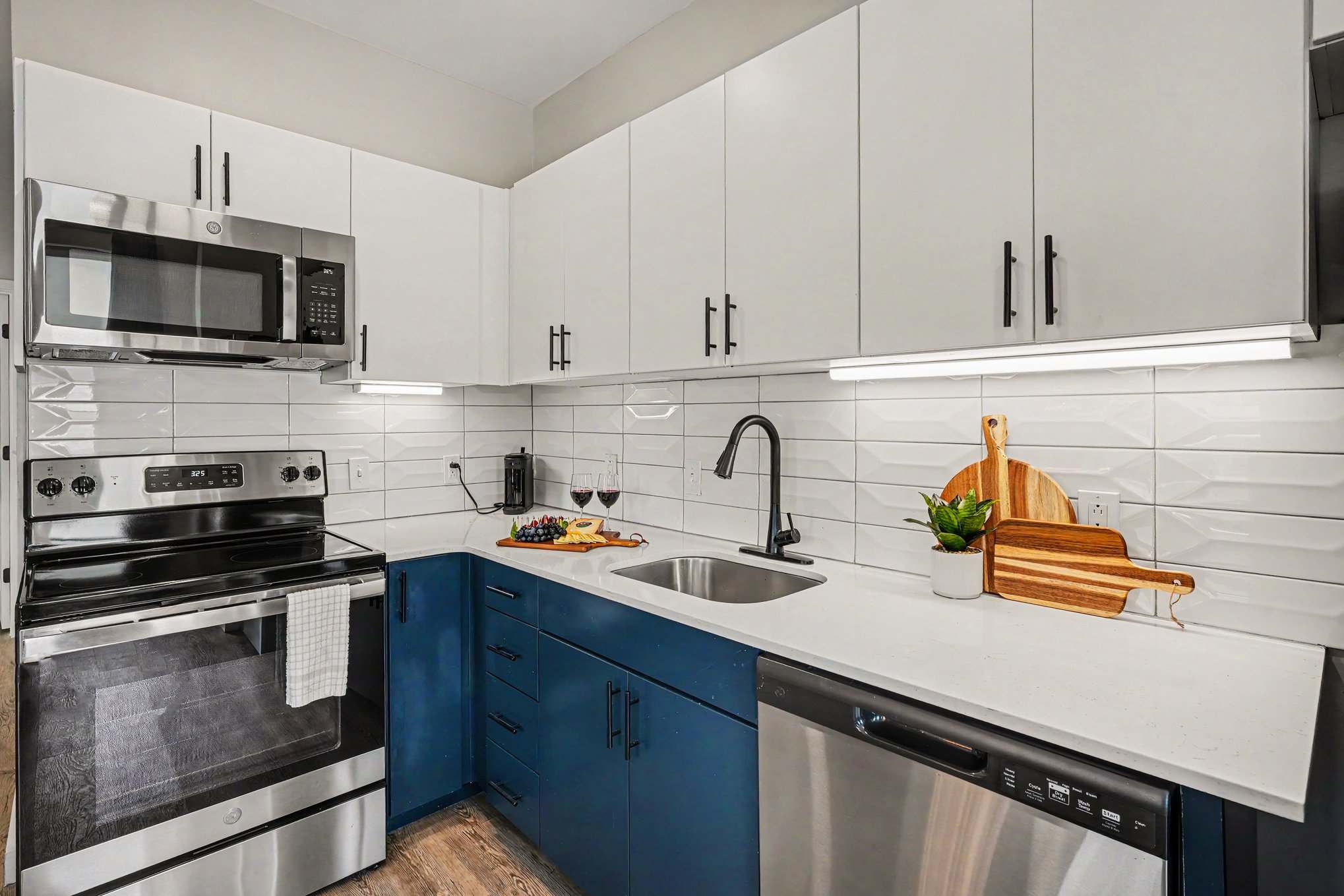 This modern kitchen features sleek stainless steel appliances, dining area for 6, and all the essentials you need for a comfortable and convenient stay. Open concept to living area.