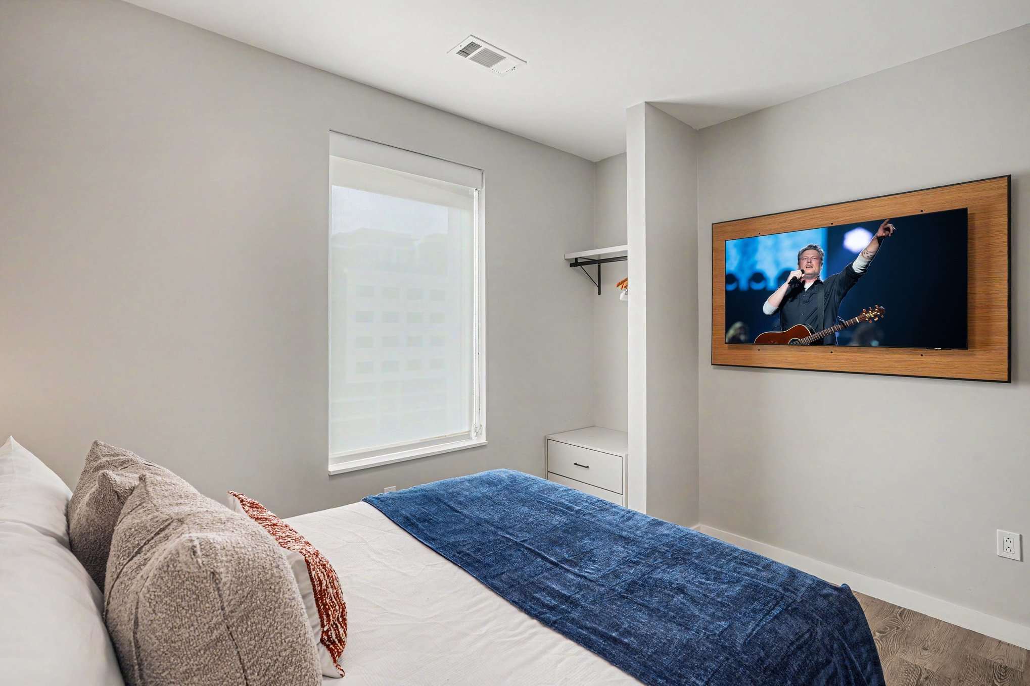 2nd Bedroom featuring a Queen bed, smart TV, and closet space