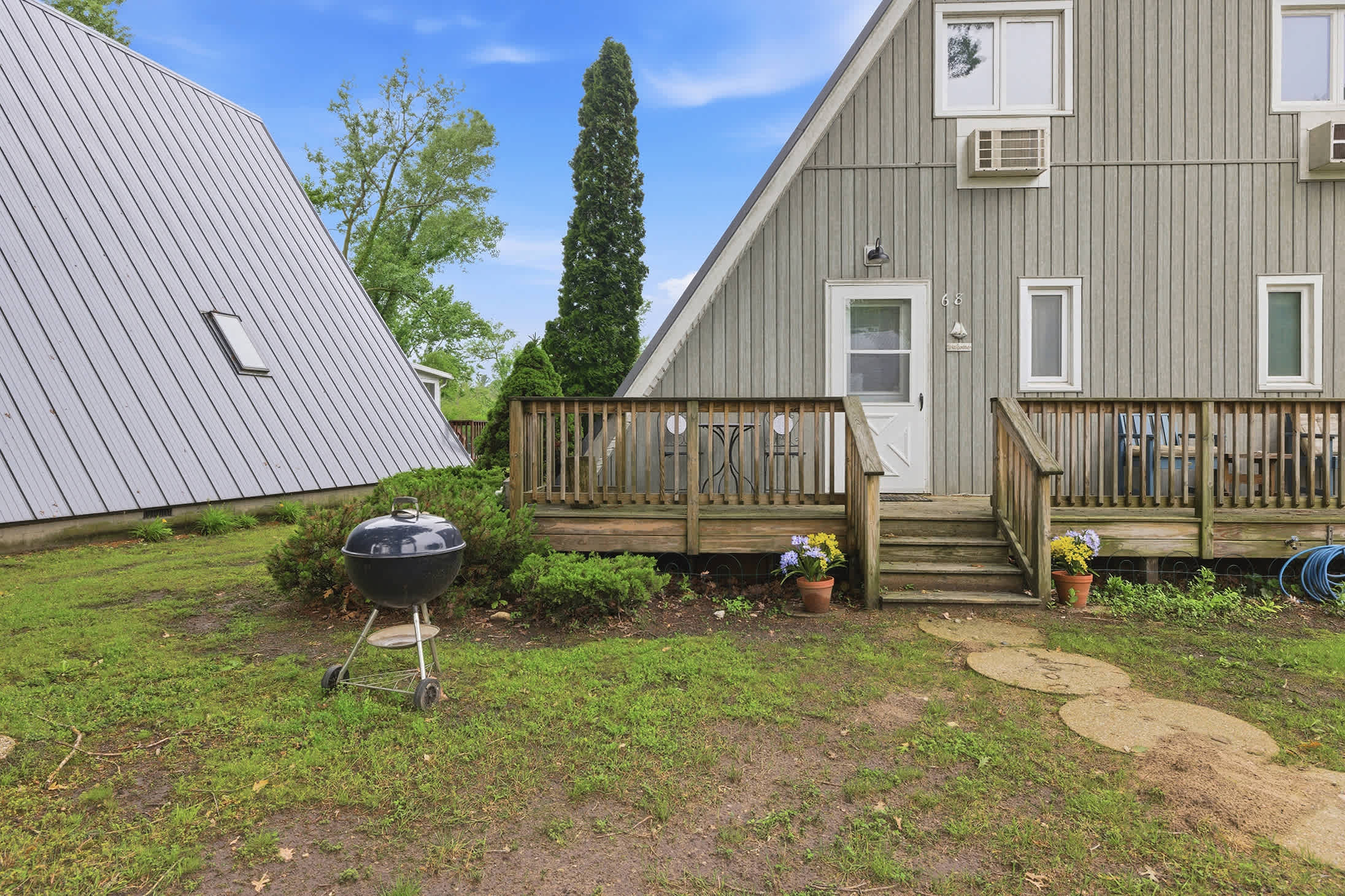 Chalet #68 includes outdoor seating and grilling for family cookouts.