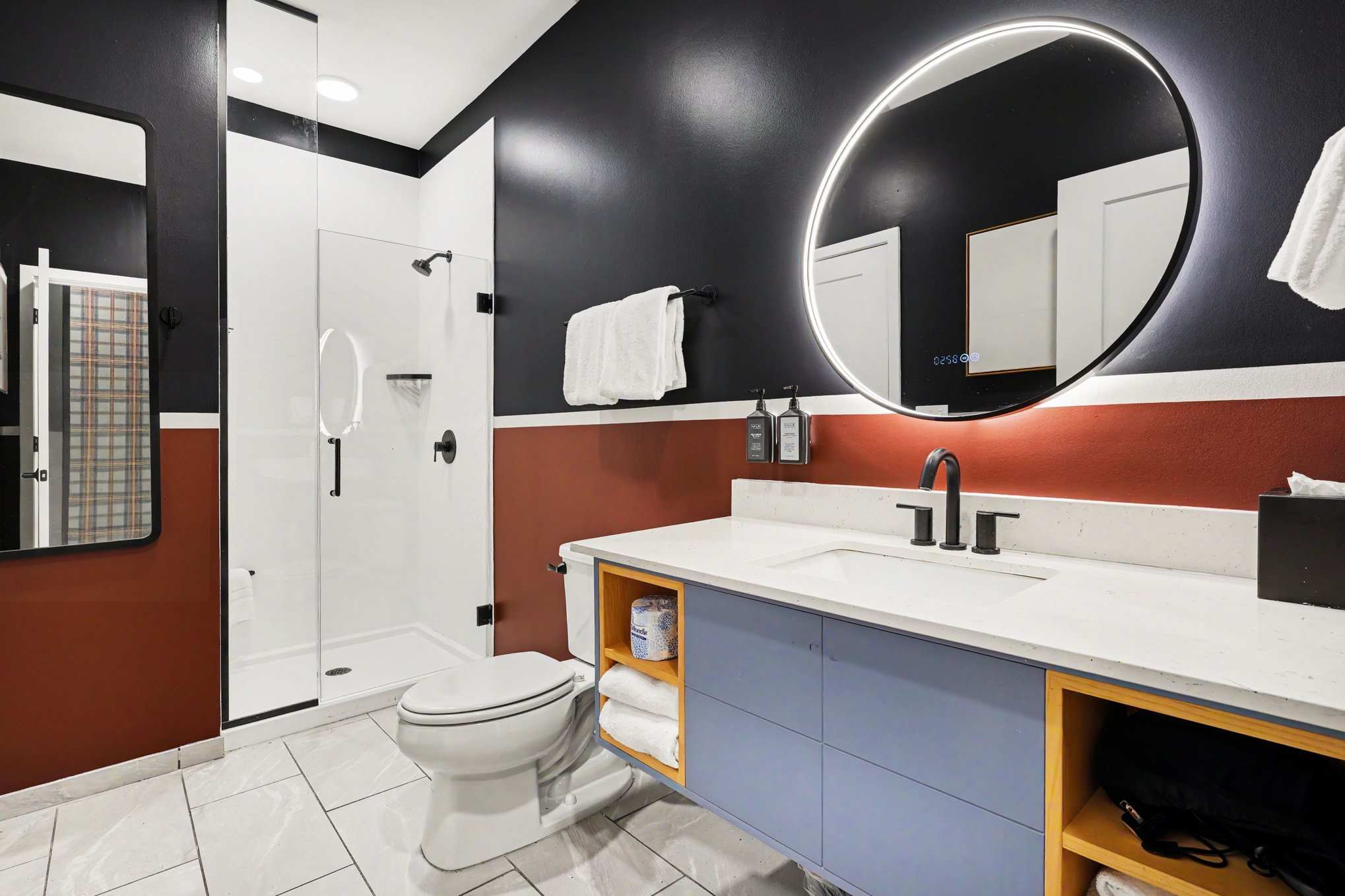 2nd Bathroom is a Jack-n-Jill featuring a single vanity and a stand-in shower.