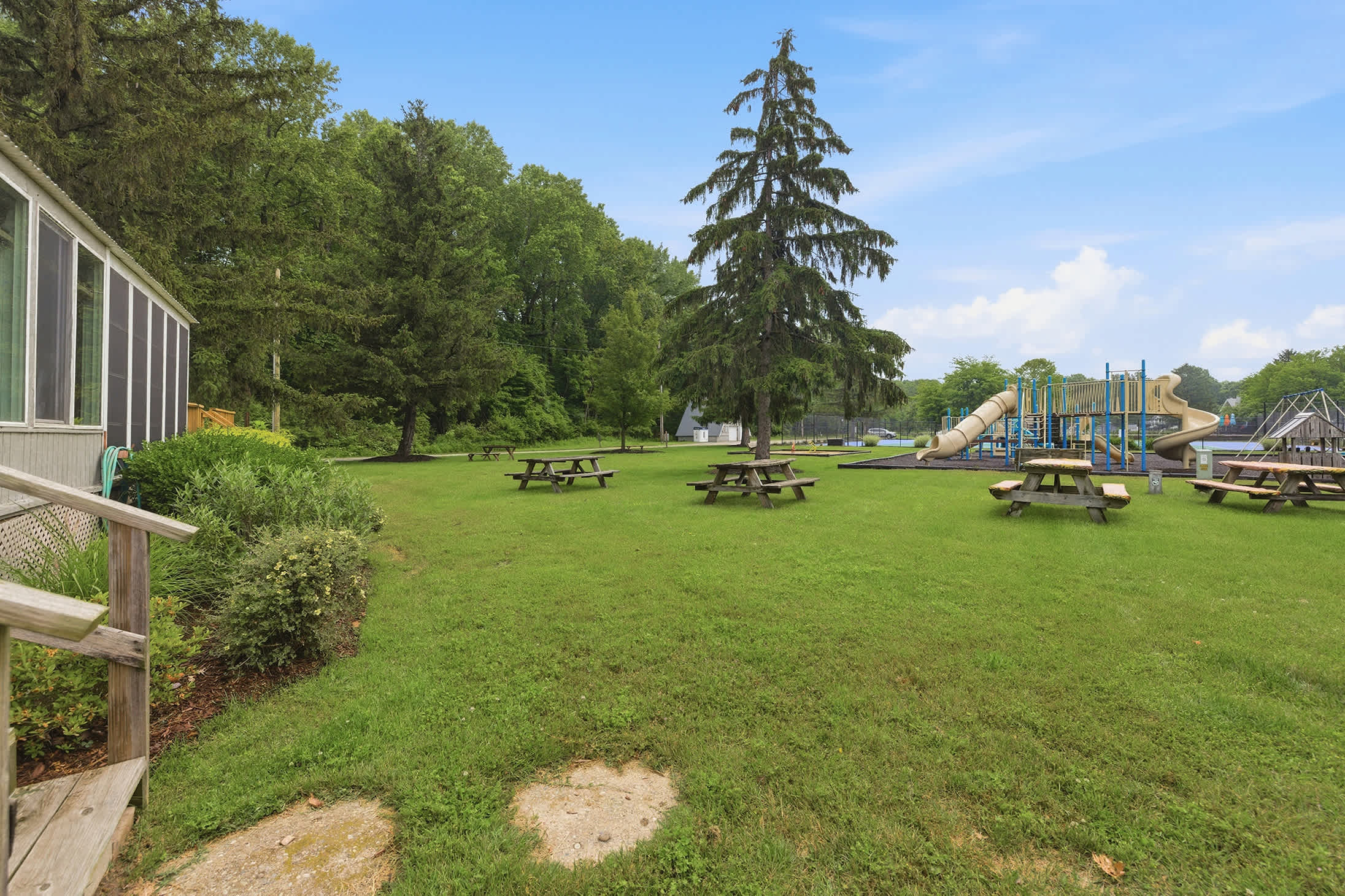 Playground, picnic areas, and open green space are just steps away.