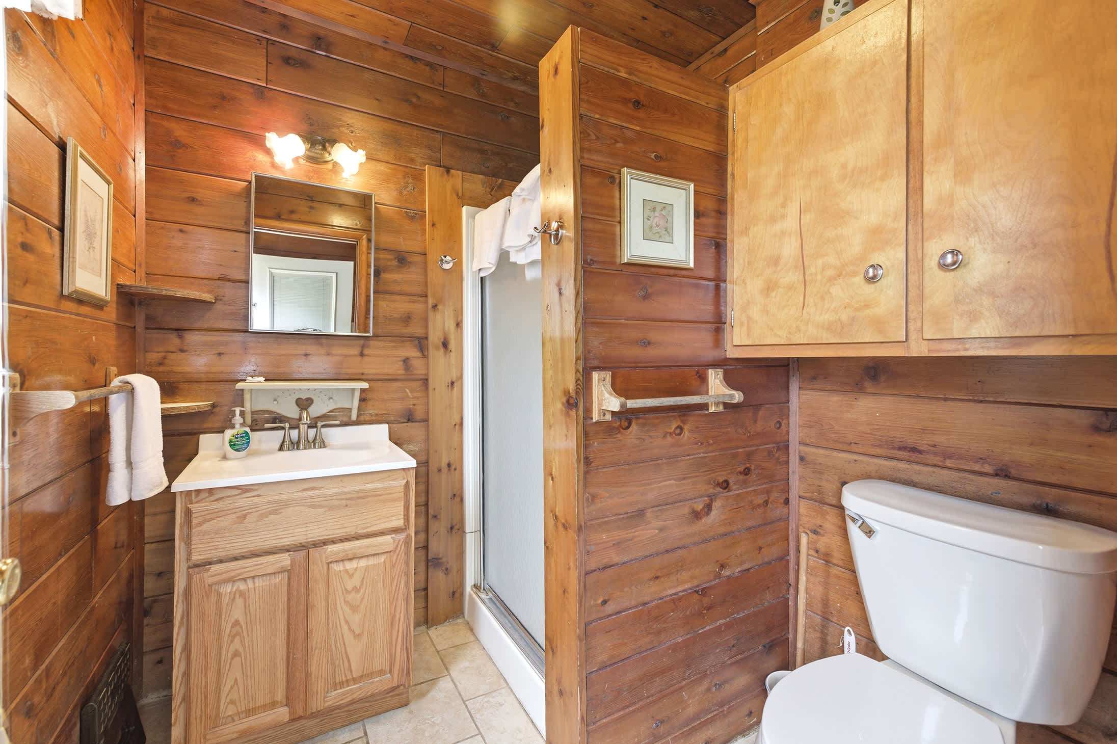 Full bathroom includes a walk-in shower and everyday essentials.