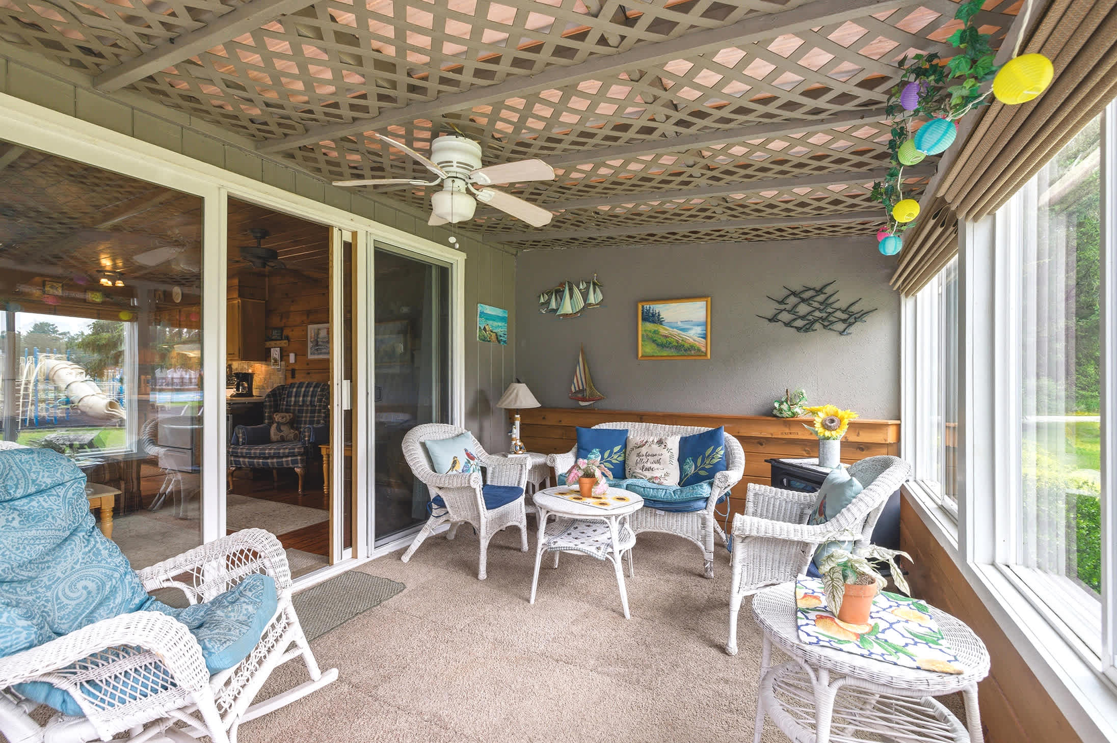 Chalet #74 screened porch adds a second living space beside the playground.