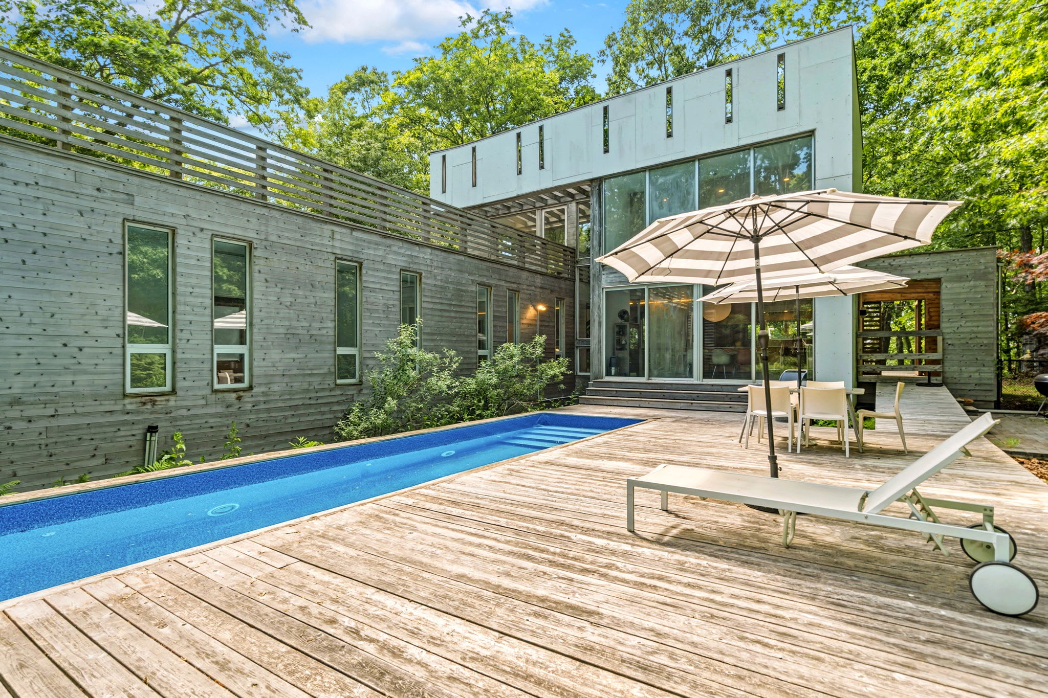 Mid-Century Southold Retreat: Heated Pool + Woods