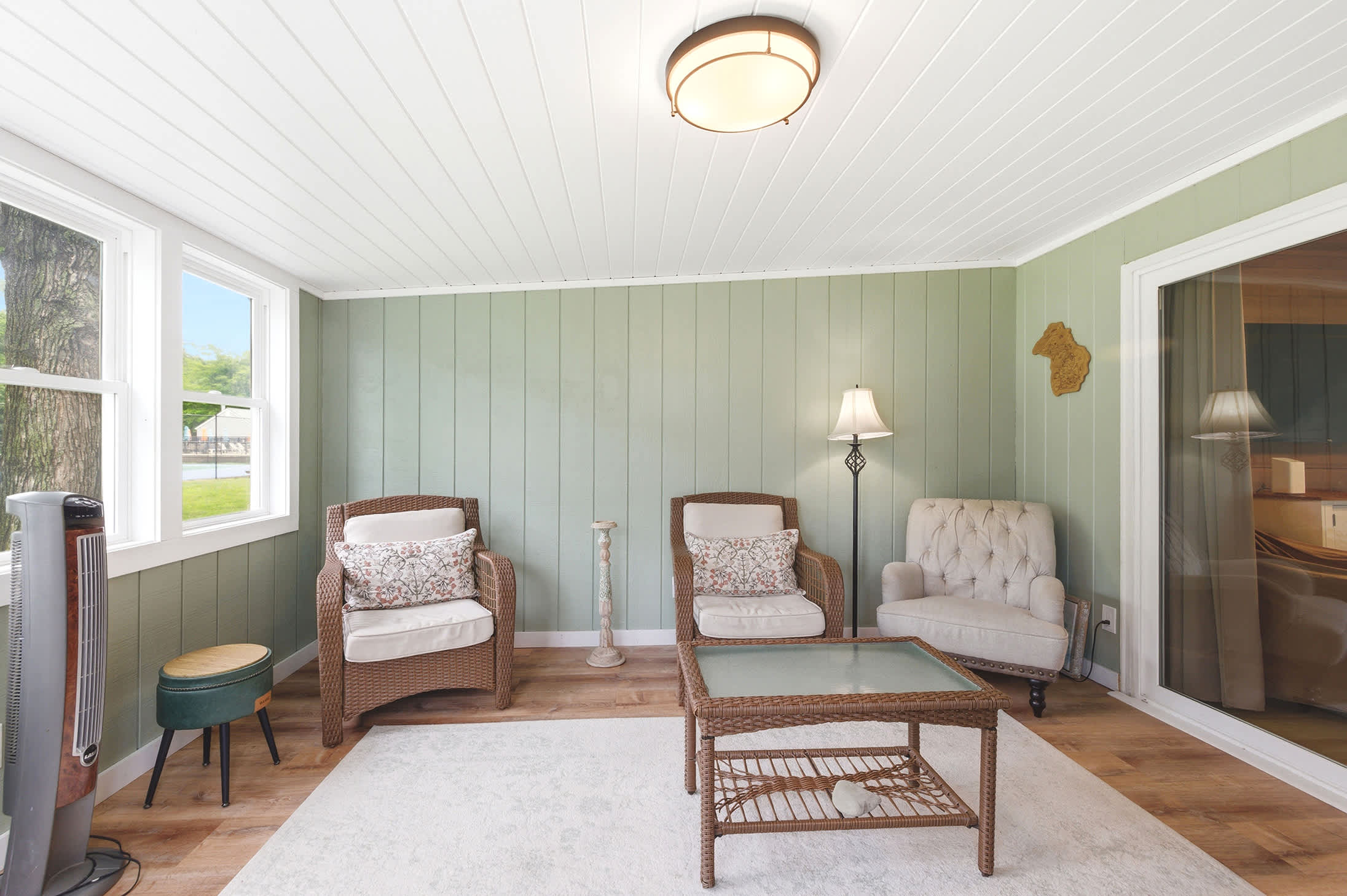 Playground views from the sunroom make it easy to keep an eye on family fun.