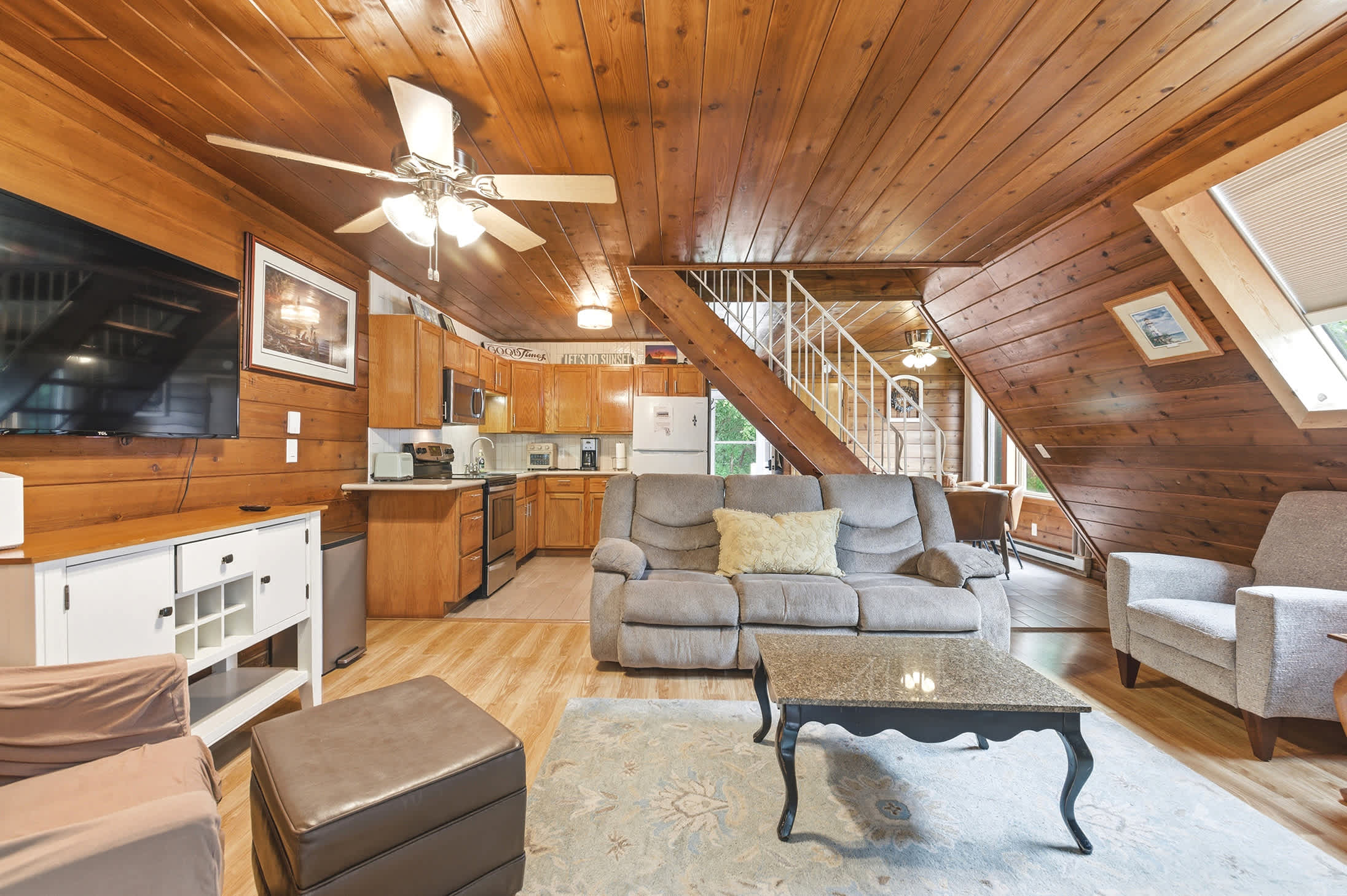 The open layout keeps the kitchen, dining, and living spaces connected.