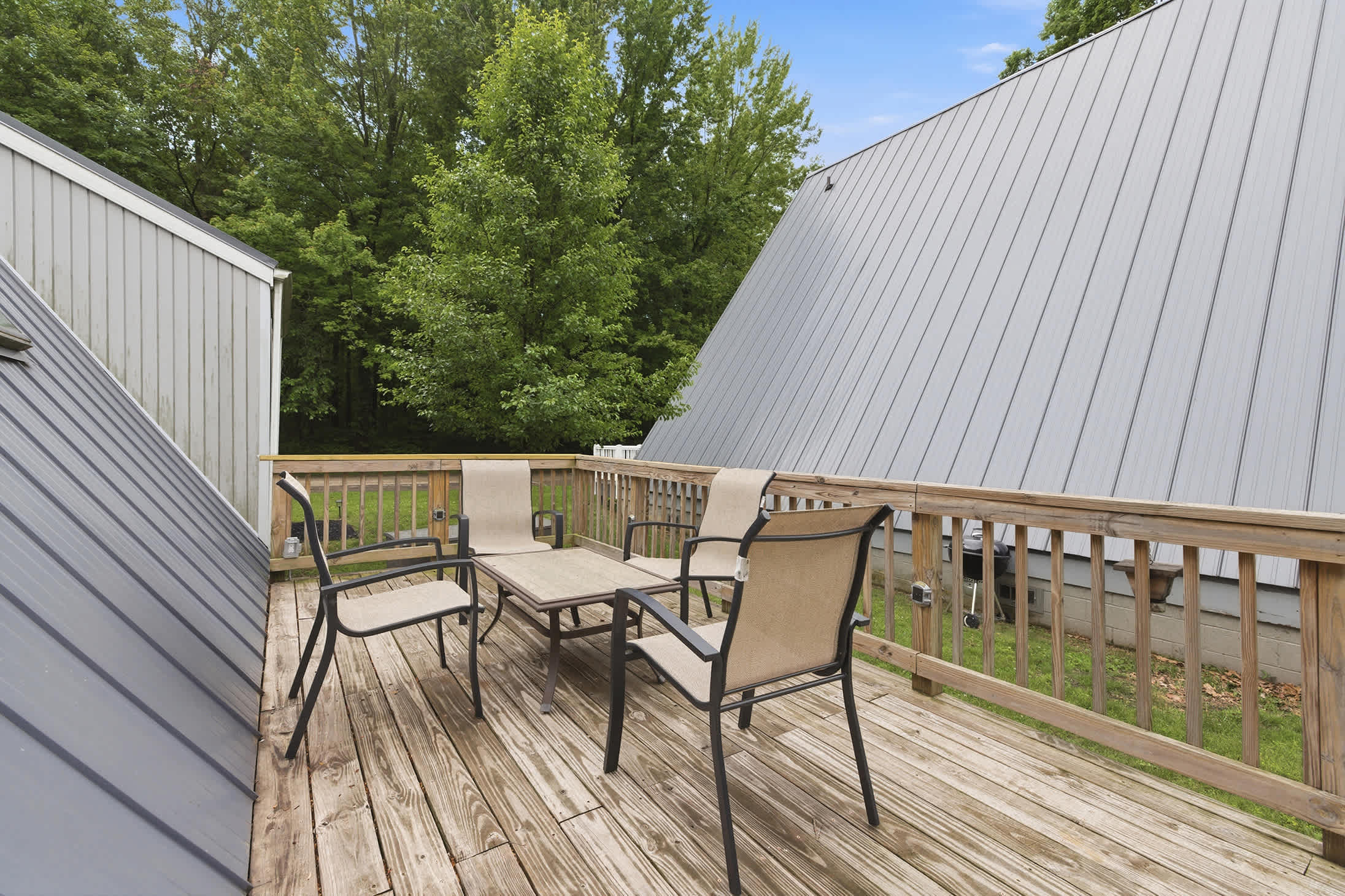 Chalet #81 features a private deck with outdoor seating for relaxing between beach and resort activities.