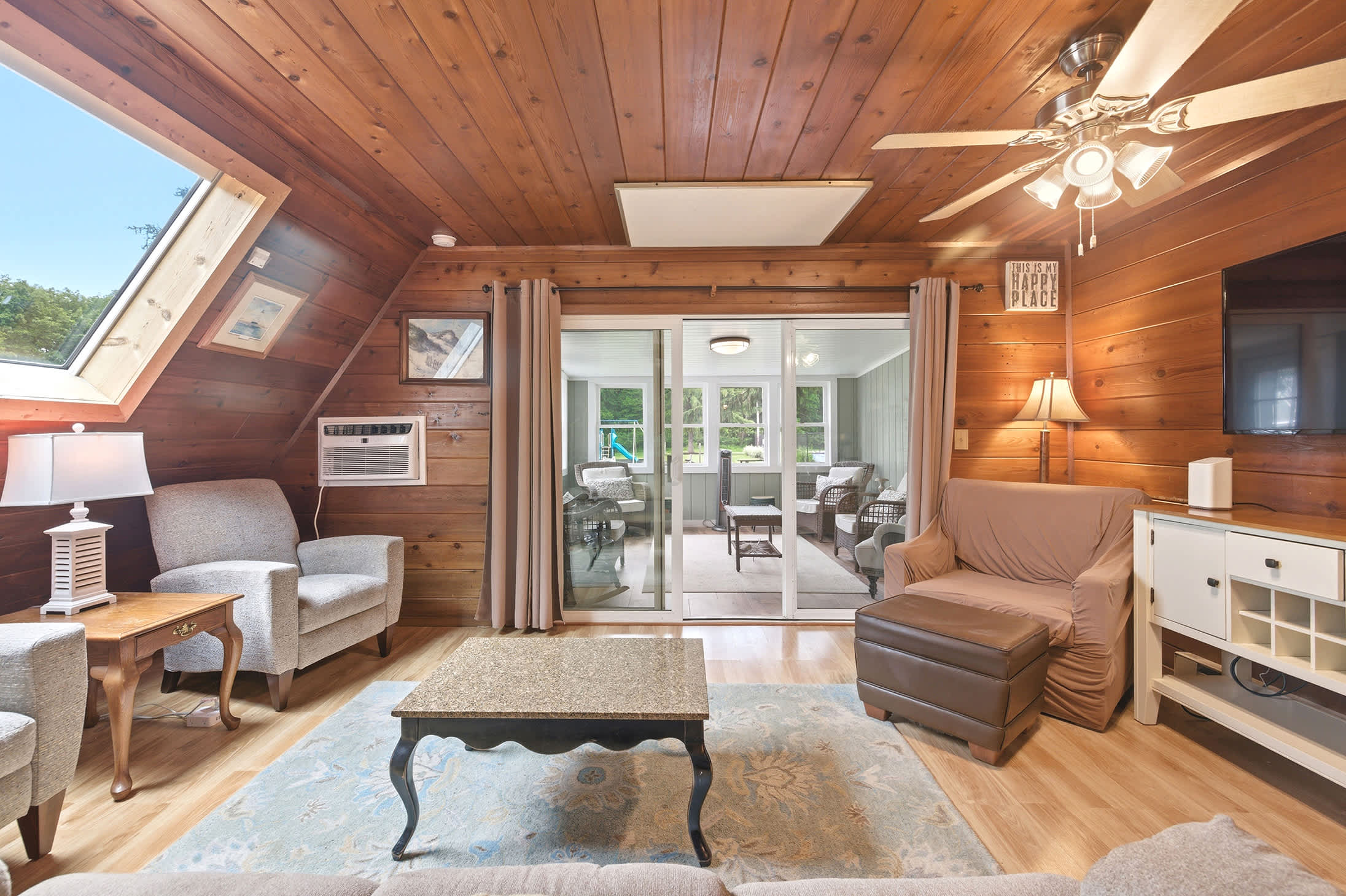 The living area connects directly to the sunroom, creating extra space to spread out.