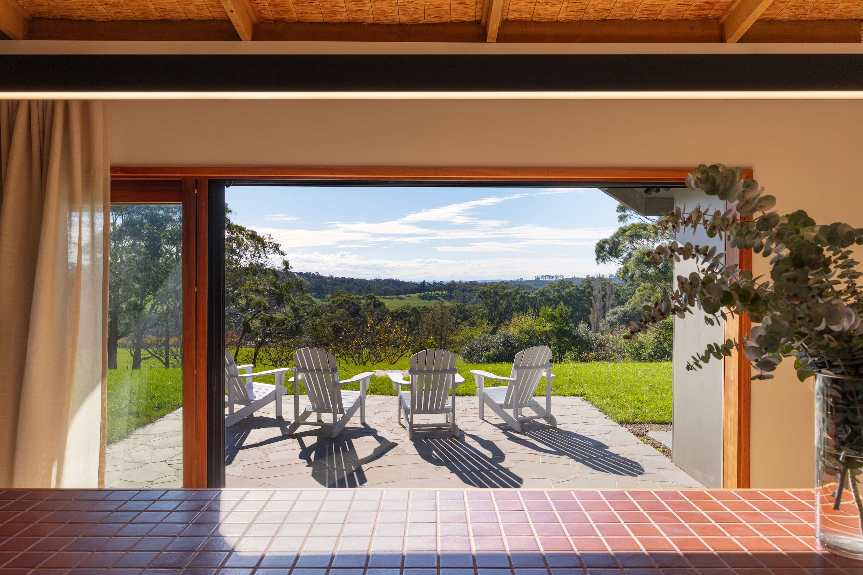 The historical homestead features perfectly framed sweeping countryside views through generous windows