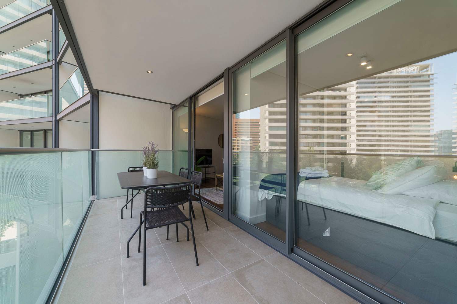 Enjoy a relaxing morning coffee on your private balcony with stunning city views.