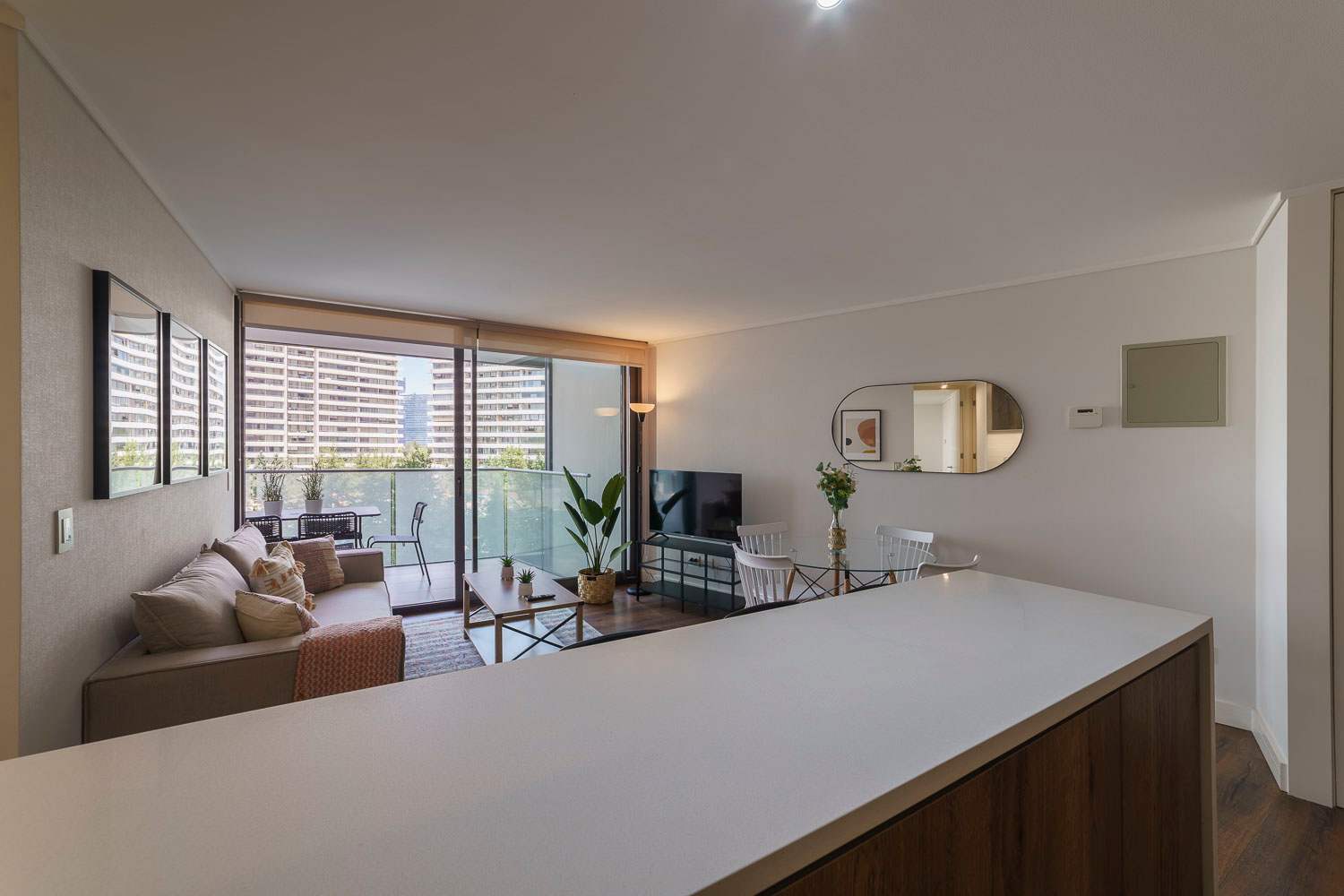 Bright and modern living area with balcony views, perfect for relaxation and entertainment.