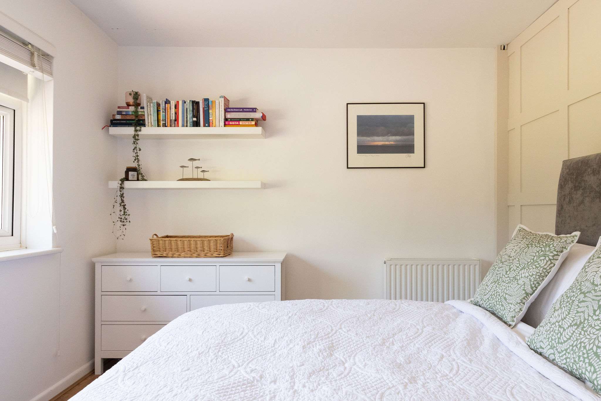 A peaceful double bedroom with soft, simple styling