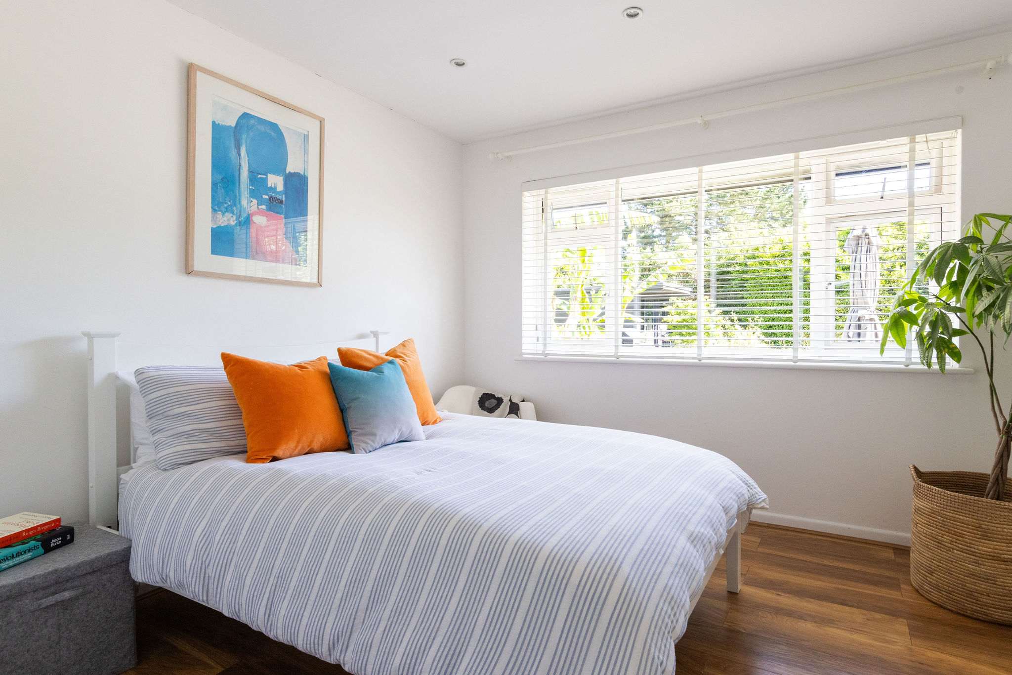 A fresh double bedroom with cheerful coastal touches