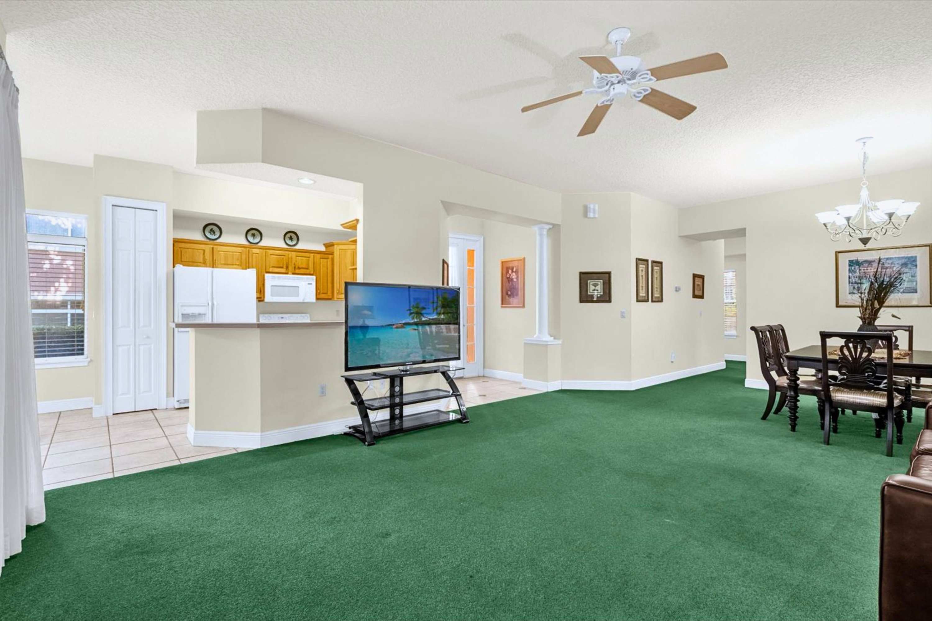 Open living, dining, and kitchen area with smart TV for meals and relaxation