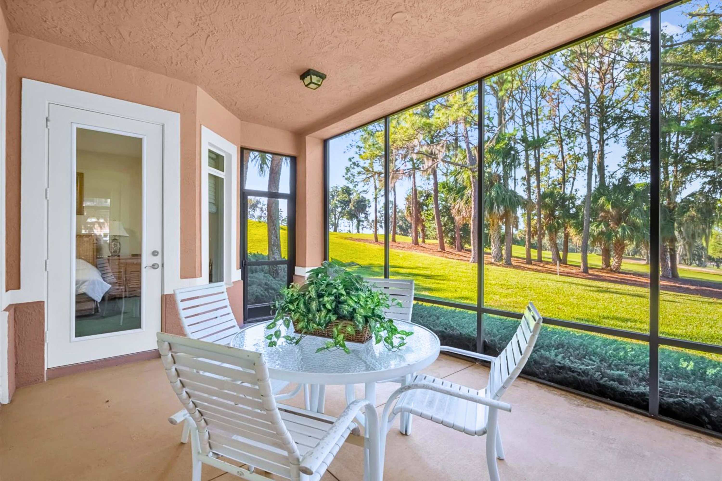 Screened in patio with outdoor dining table for 4