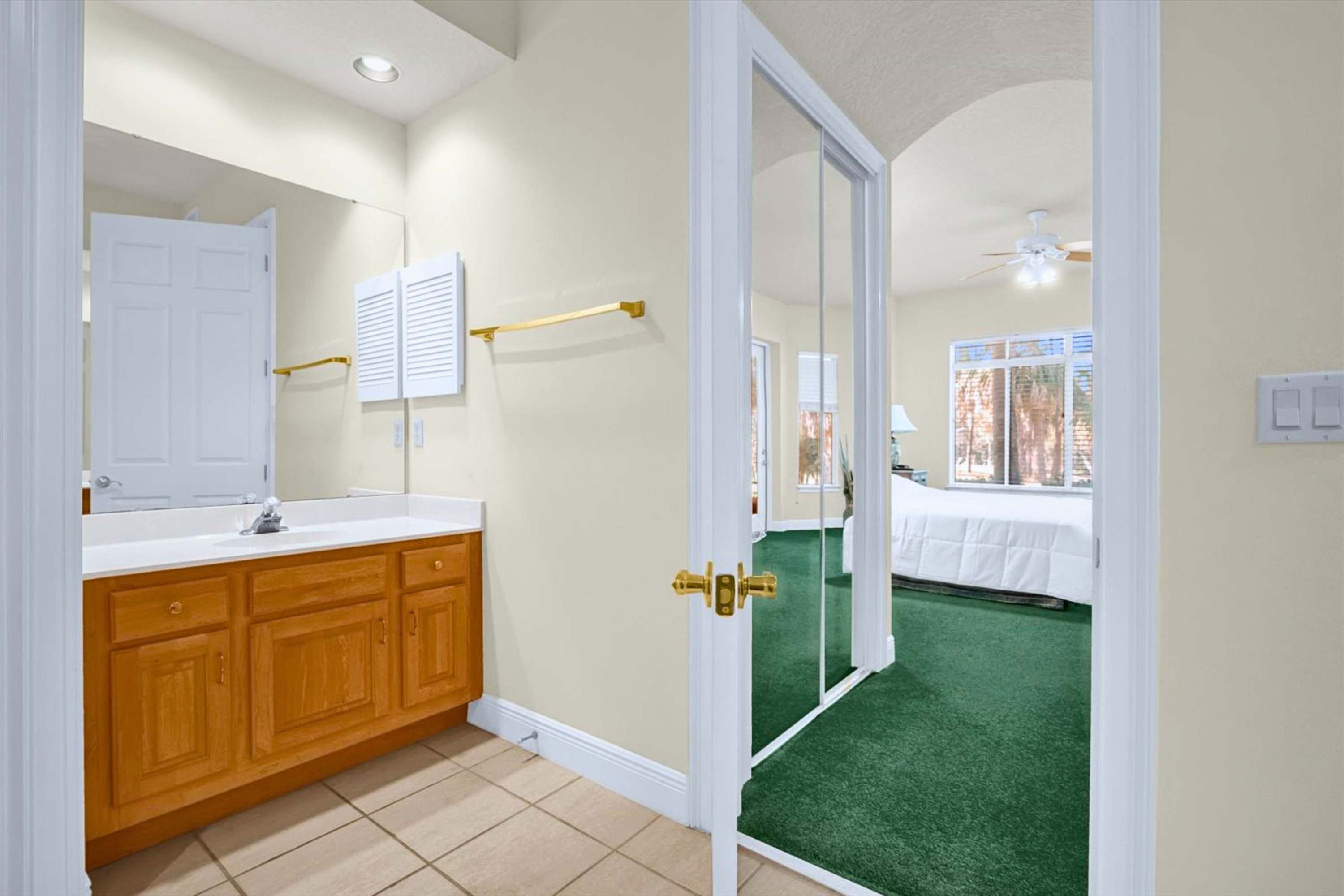 Bathroom with access to the primary bedroom