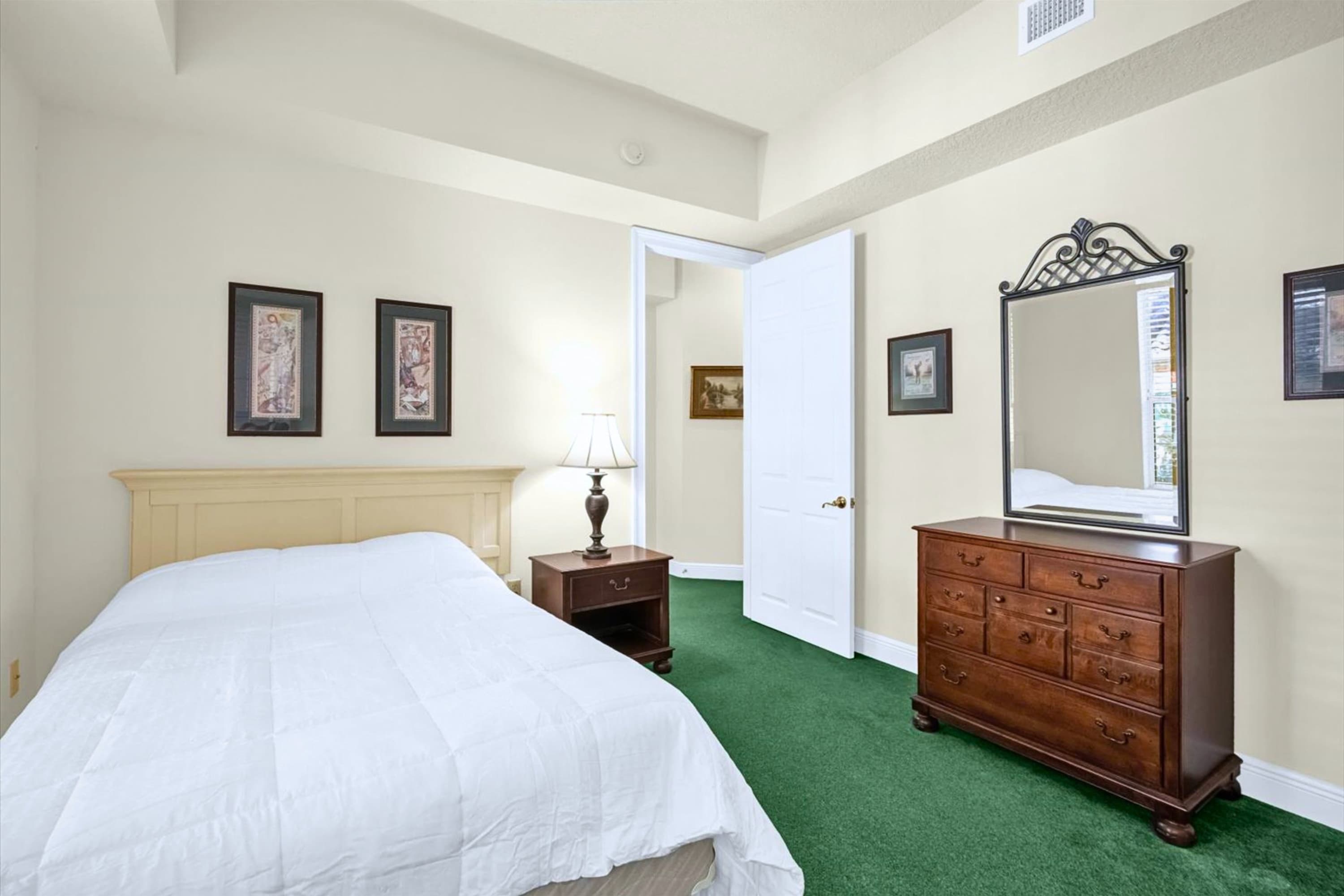 Full bed with dresser, practical setup for longer stays