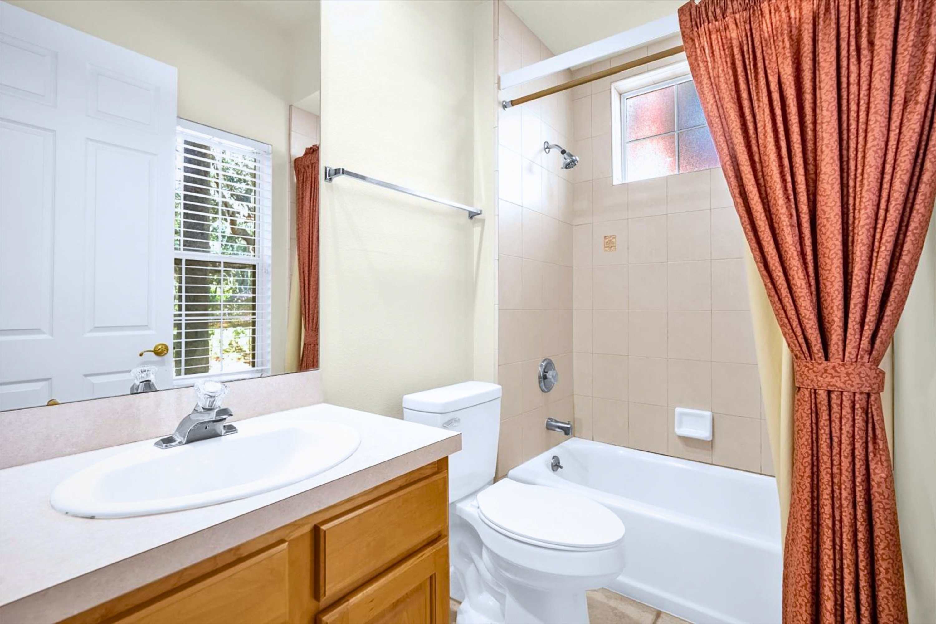 Bathroom with bathtub and shower setup