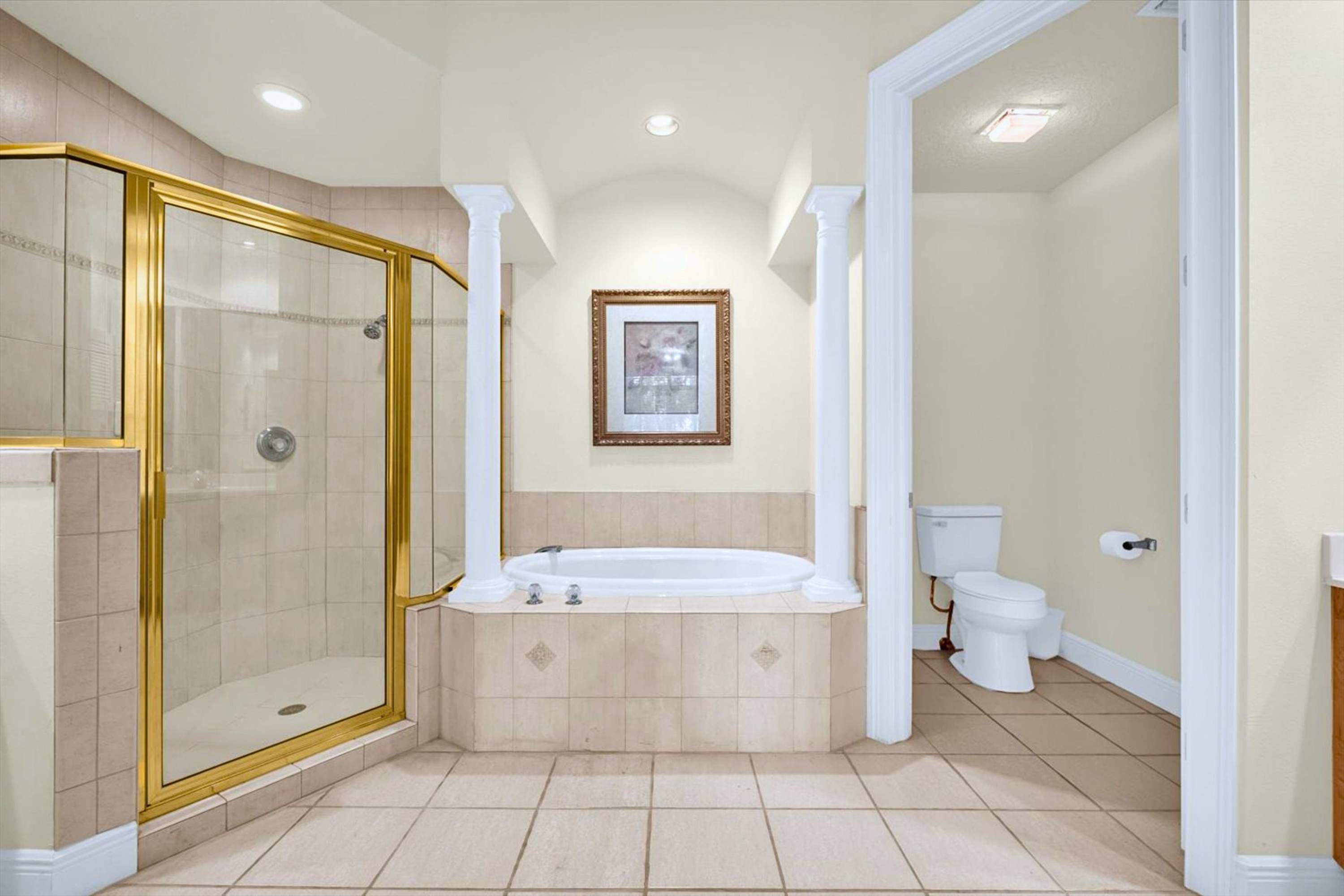Bathroom featuring a walk in shower and bathtub, offering both quick refreshes and relaxing soaks during your stay