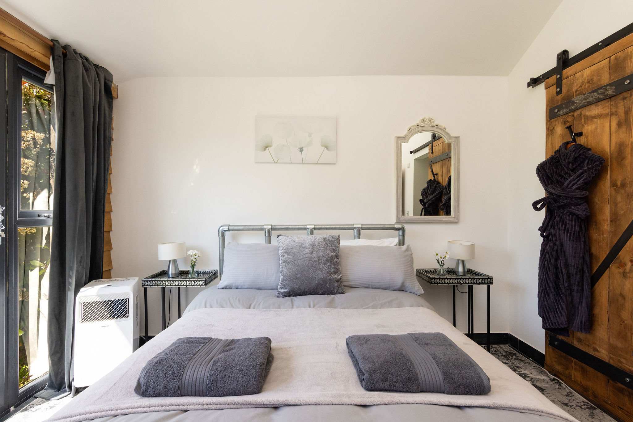 Unwind in this stylish, tranquil double bedroom with modern rustic touches.