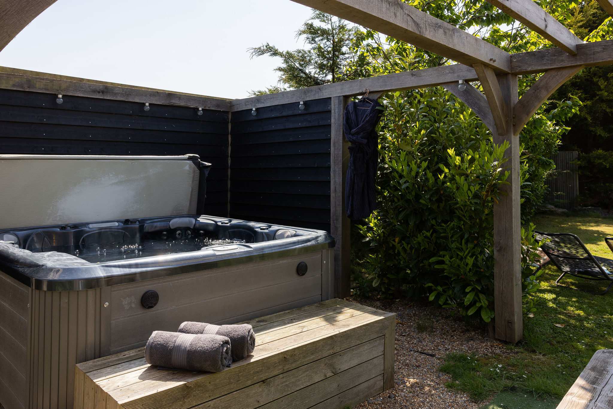 Step outside into your private courtyard and unwind in the luxurious outdoor hot tub.