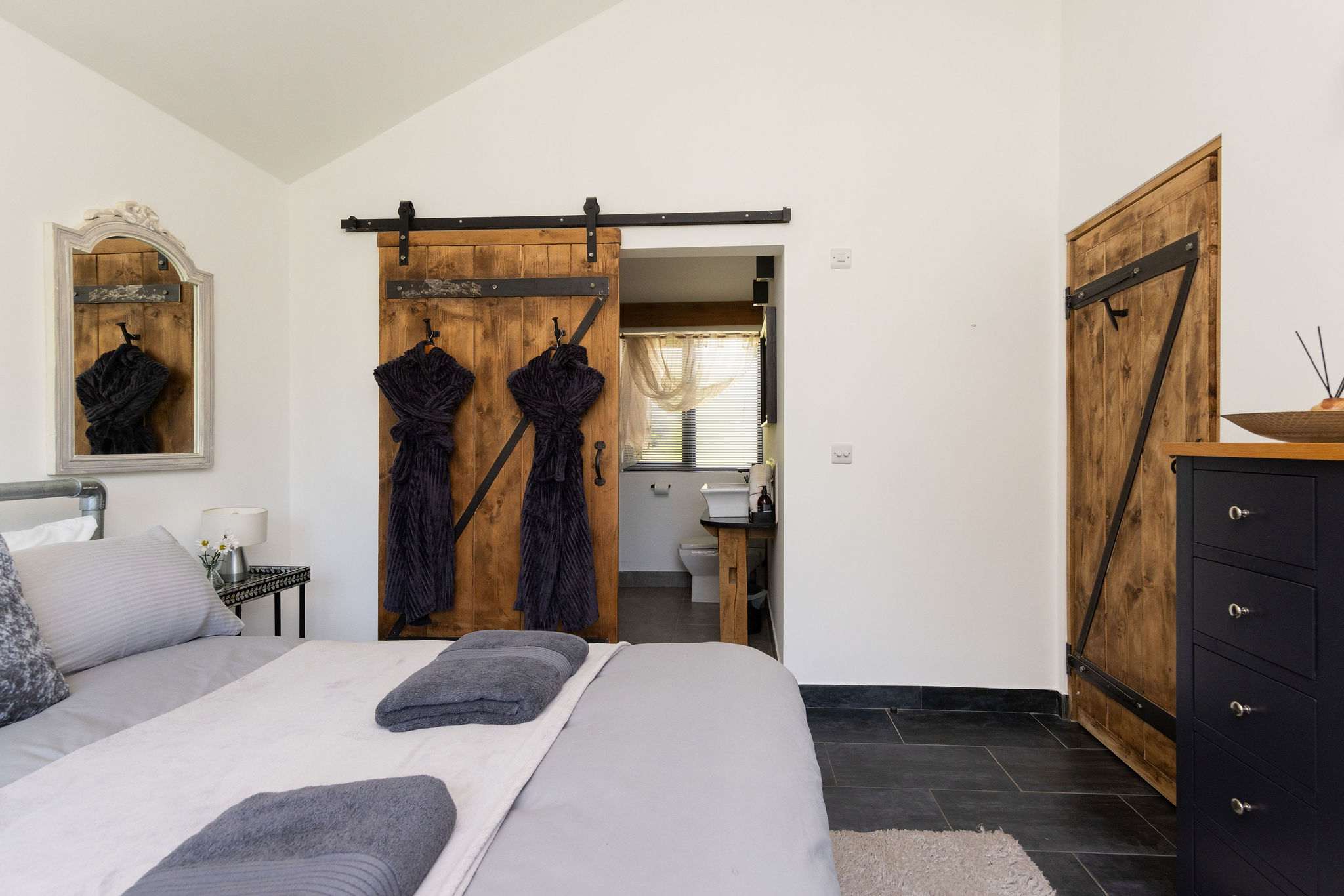 Experience ultimate comfort in this beautifully furnished bedroom complete with a convenient ensuite bathroom.