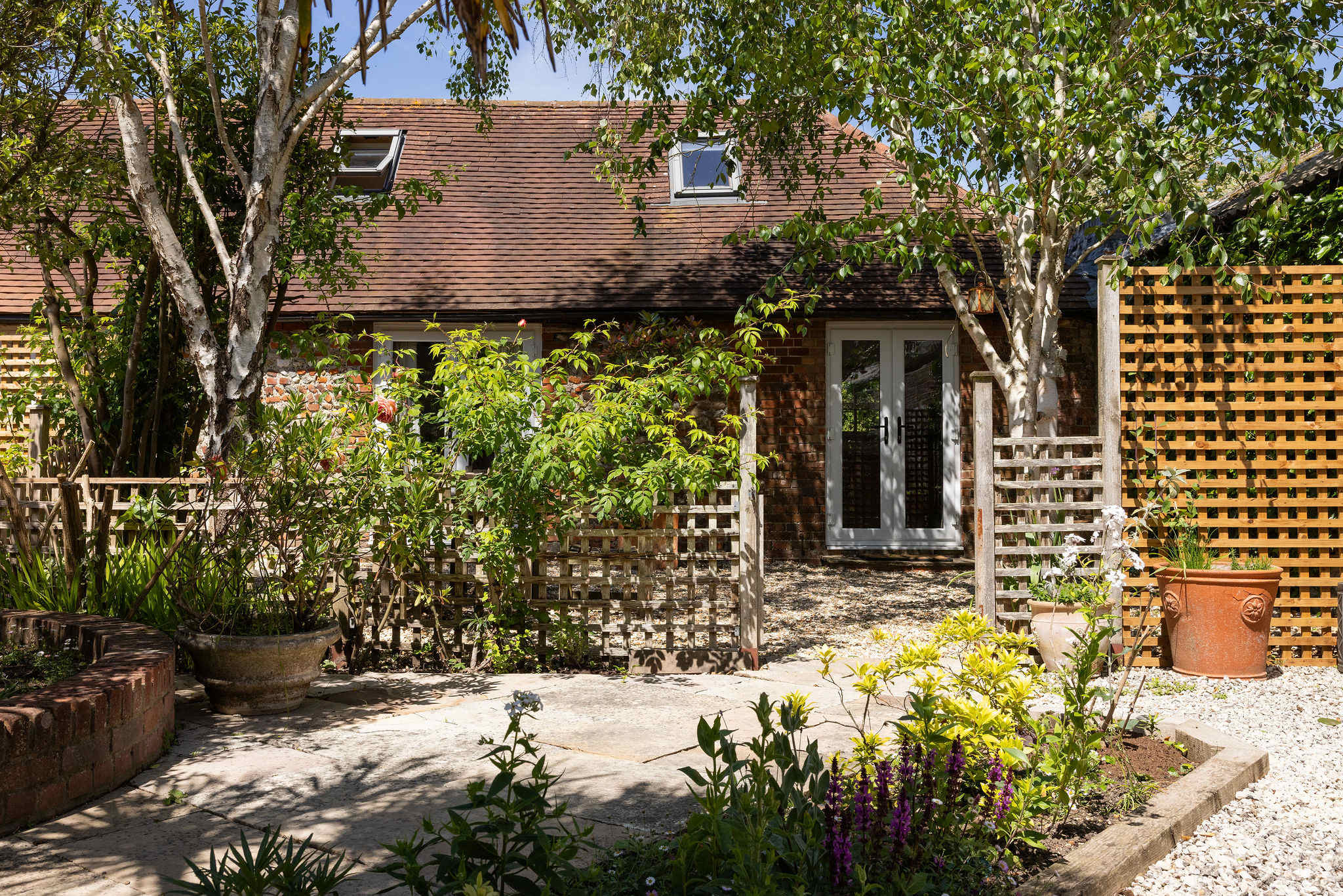 Trees, shrubs and flowering plants bloom in the spring and summer.
