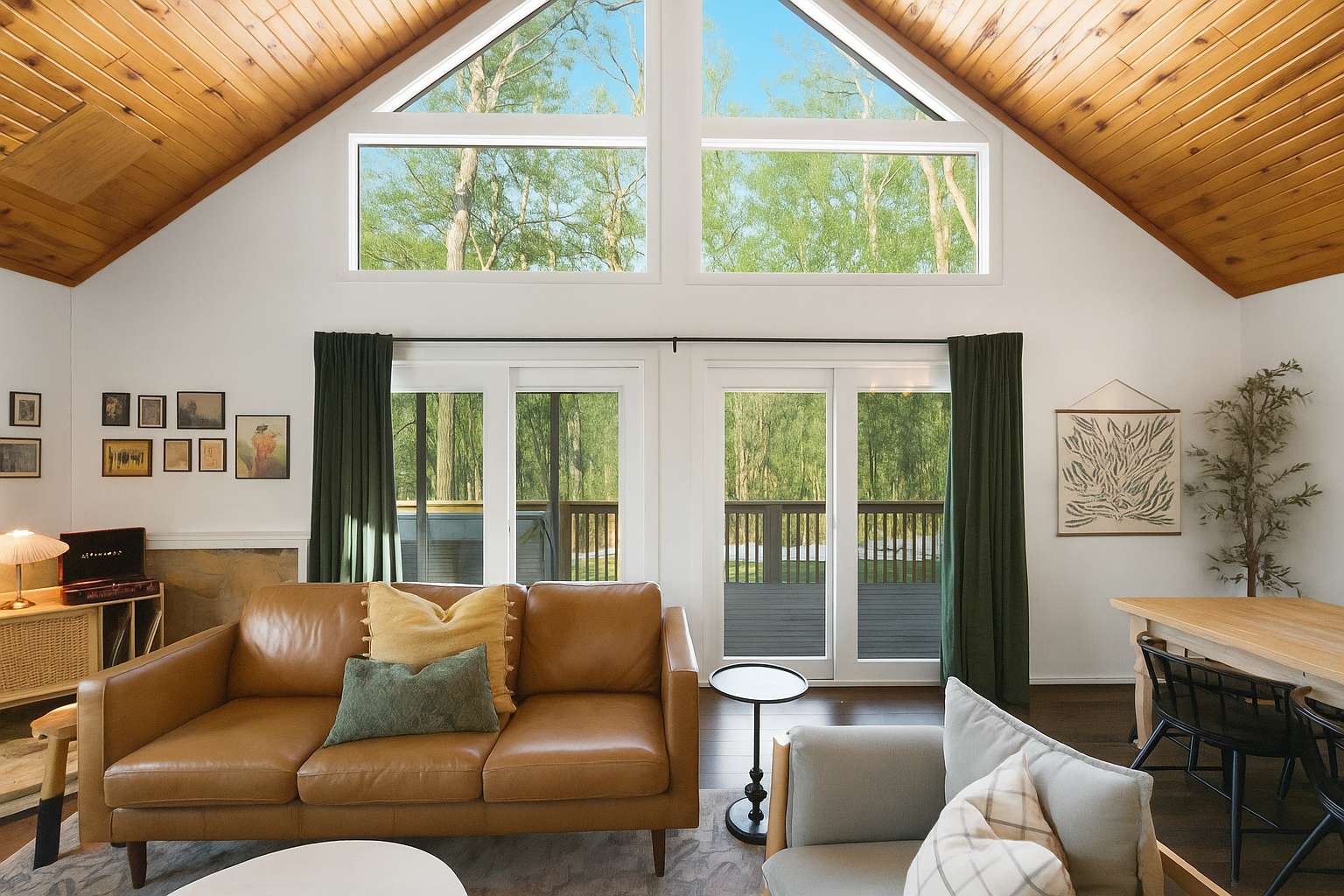 Cozy cabin retreat with modern boho furnishings and thoughtful touches throughout, featuring warm wood beam ceilings and a relaxing, nature-inspired vibe.