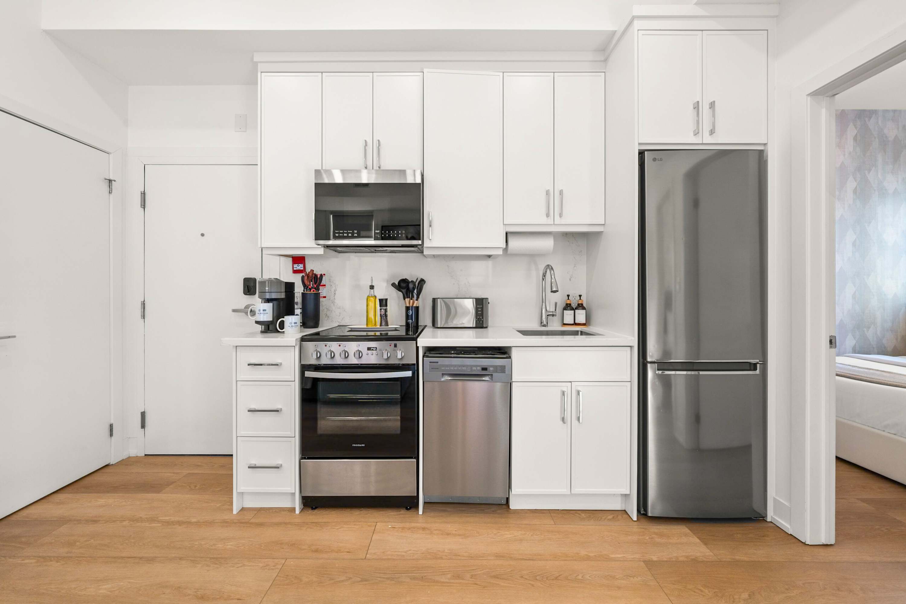 Fully equipped kitchen with silver appliances.