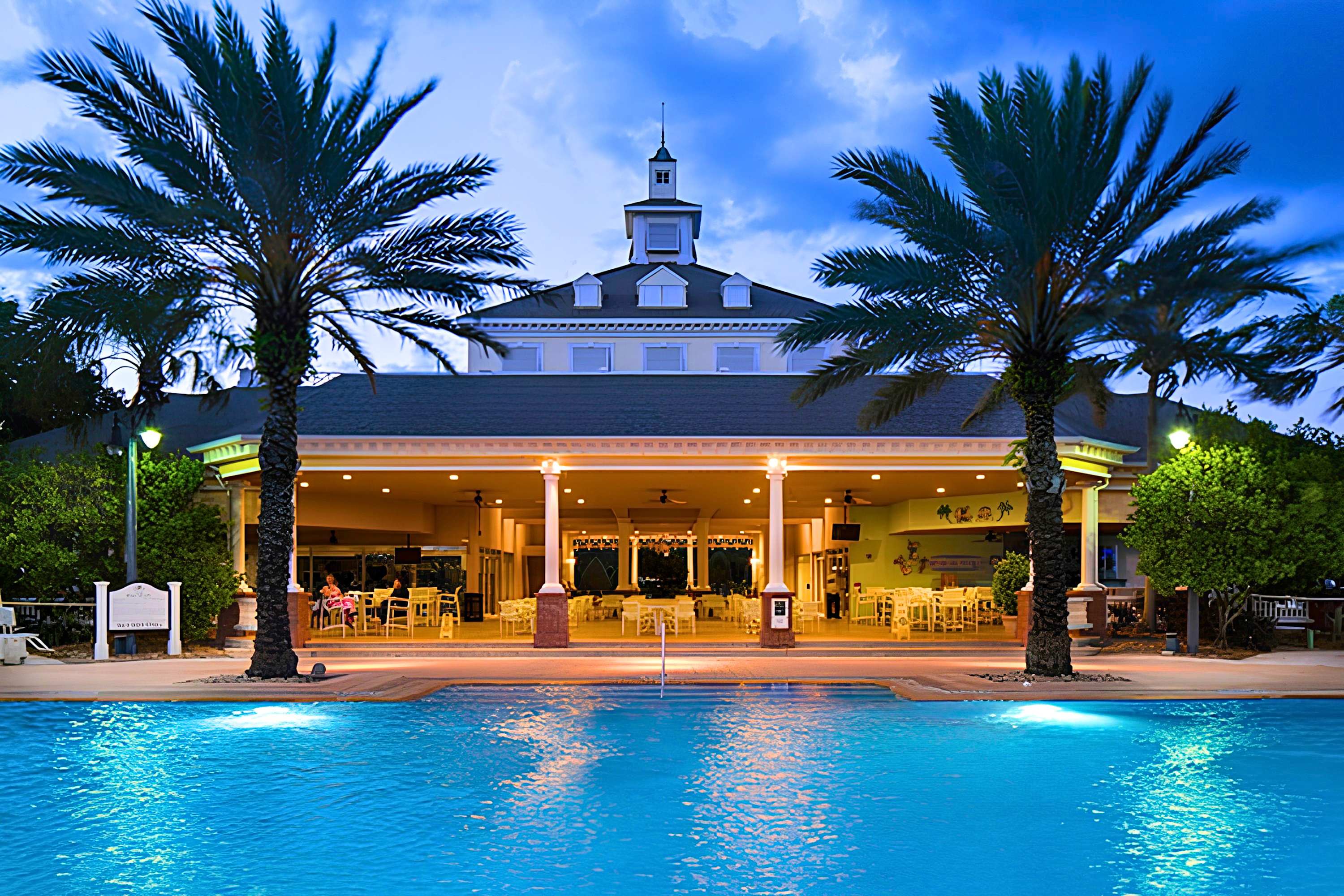 Seven Eagles Pool with hot tubs, lounge seating, and a poolside tiki bar perfect for relaxing after the parks