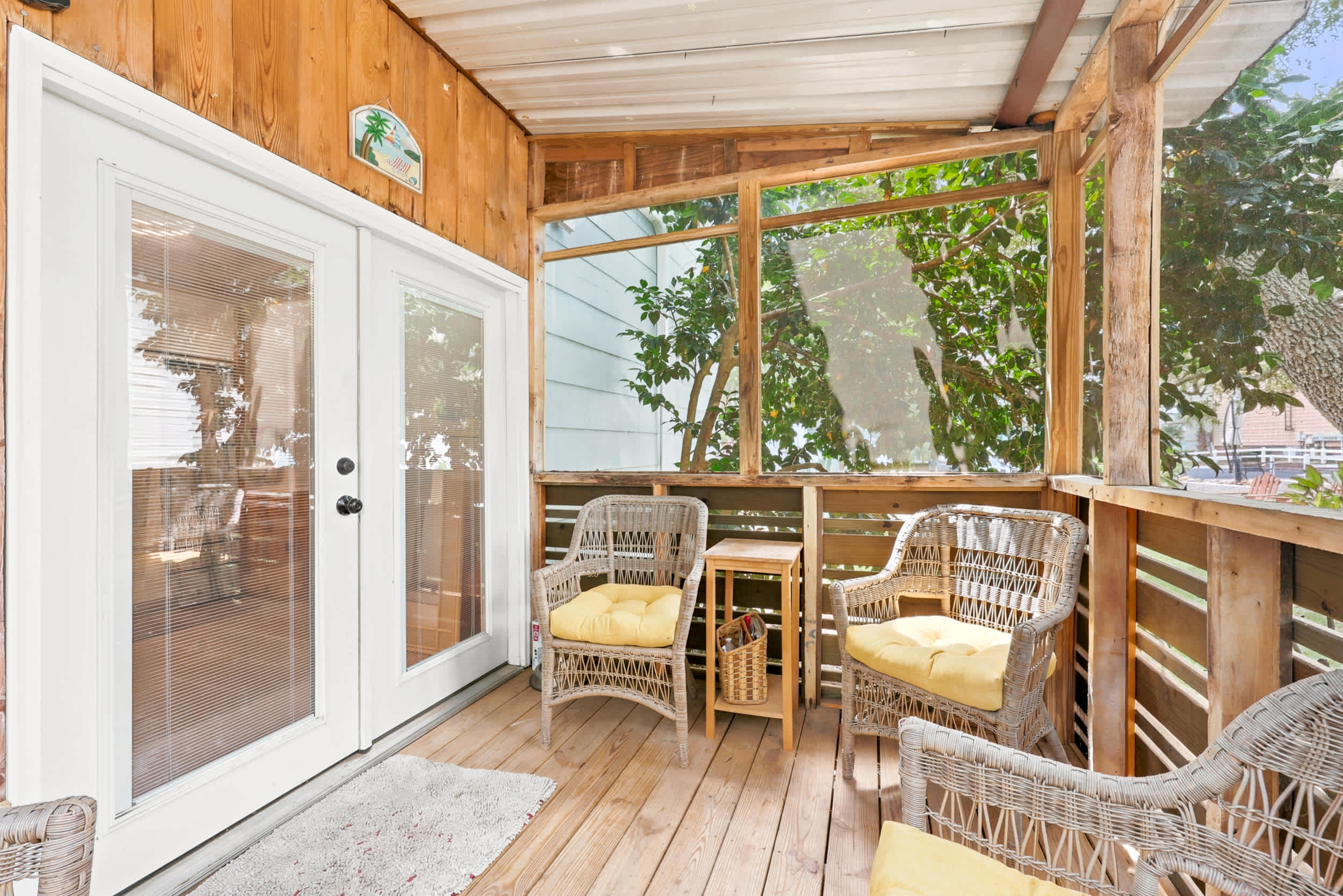 Screened Porch overlooking outdoor bar and dining area