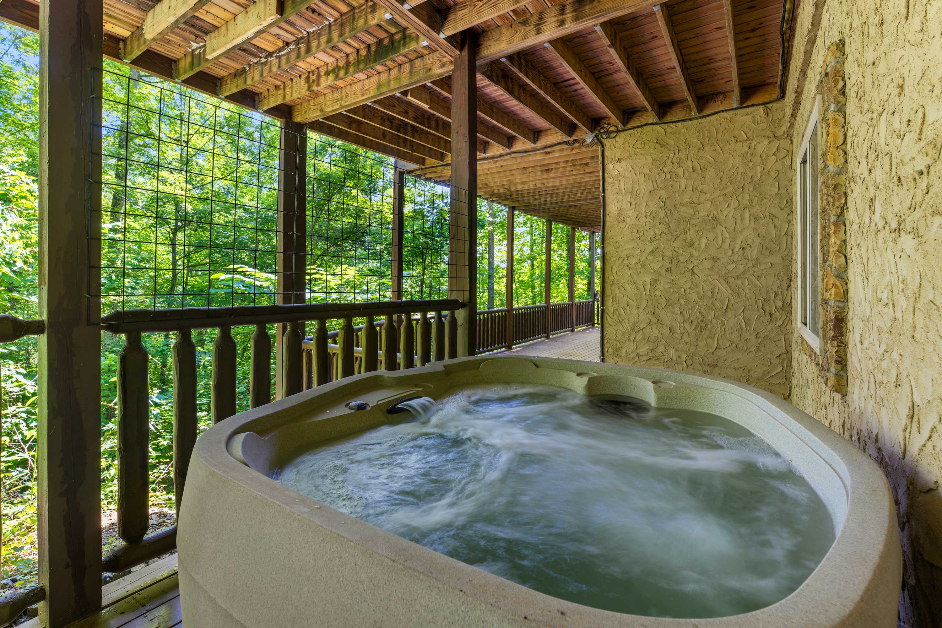Relax after a day of fun in the private, covered hot tub surrounded by beautiful nature views. (Hot tub unavailable until further notice)
