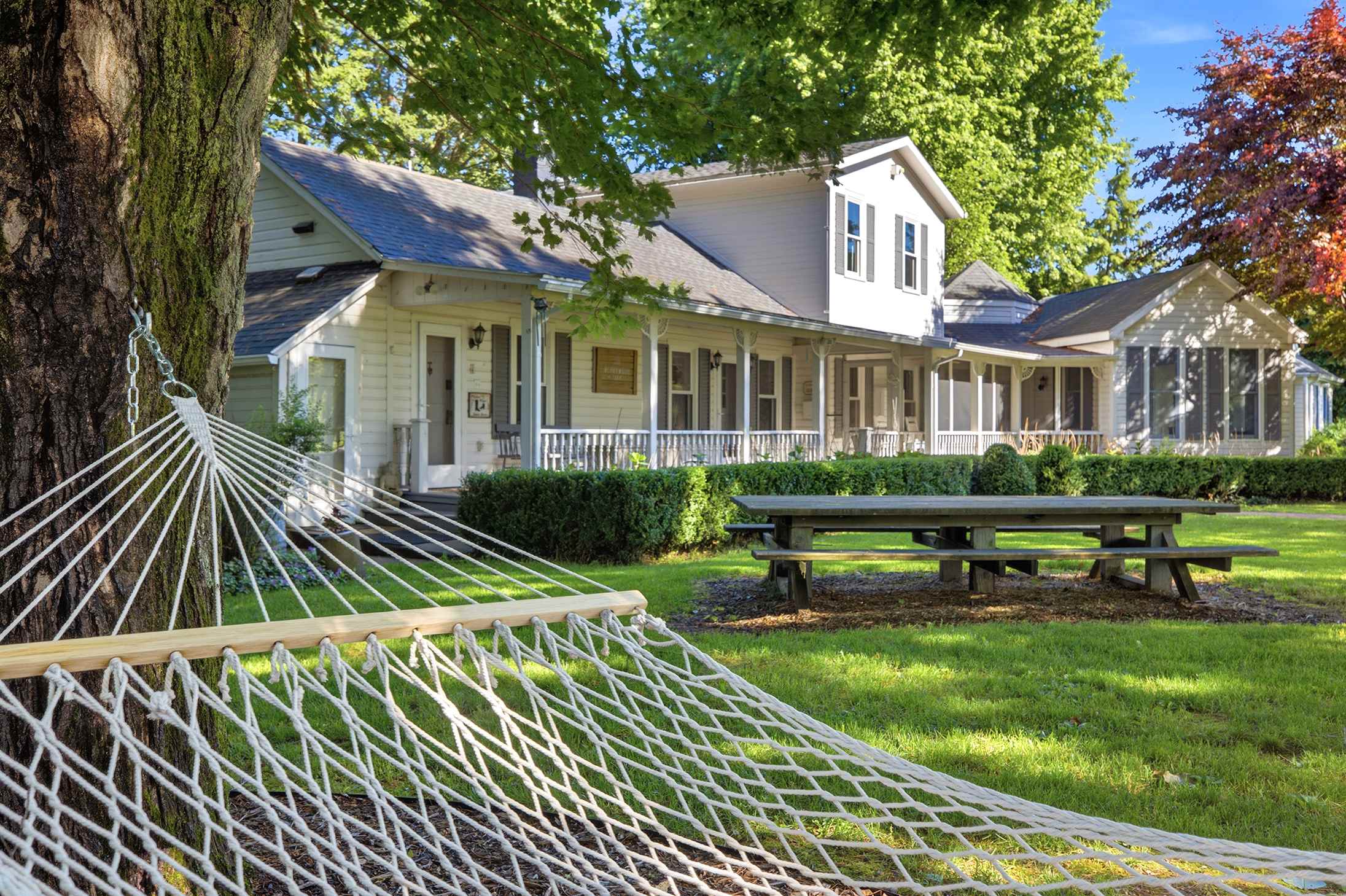 Front-porch charm with a hammock to match.