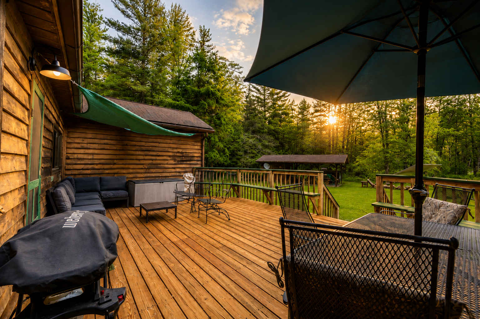 Large back deck with lounge seating and dining area