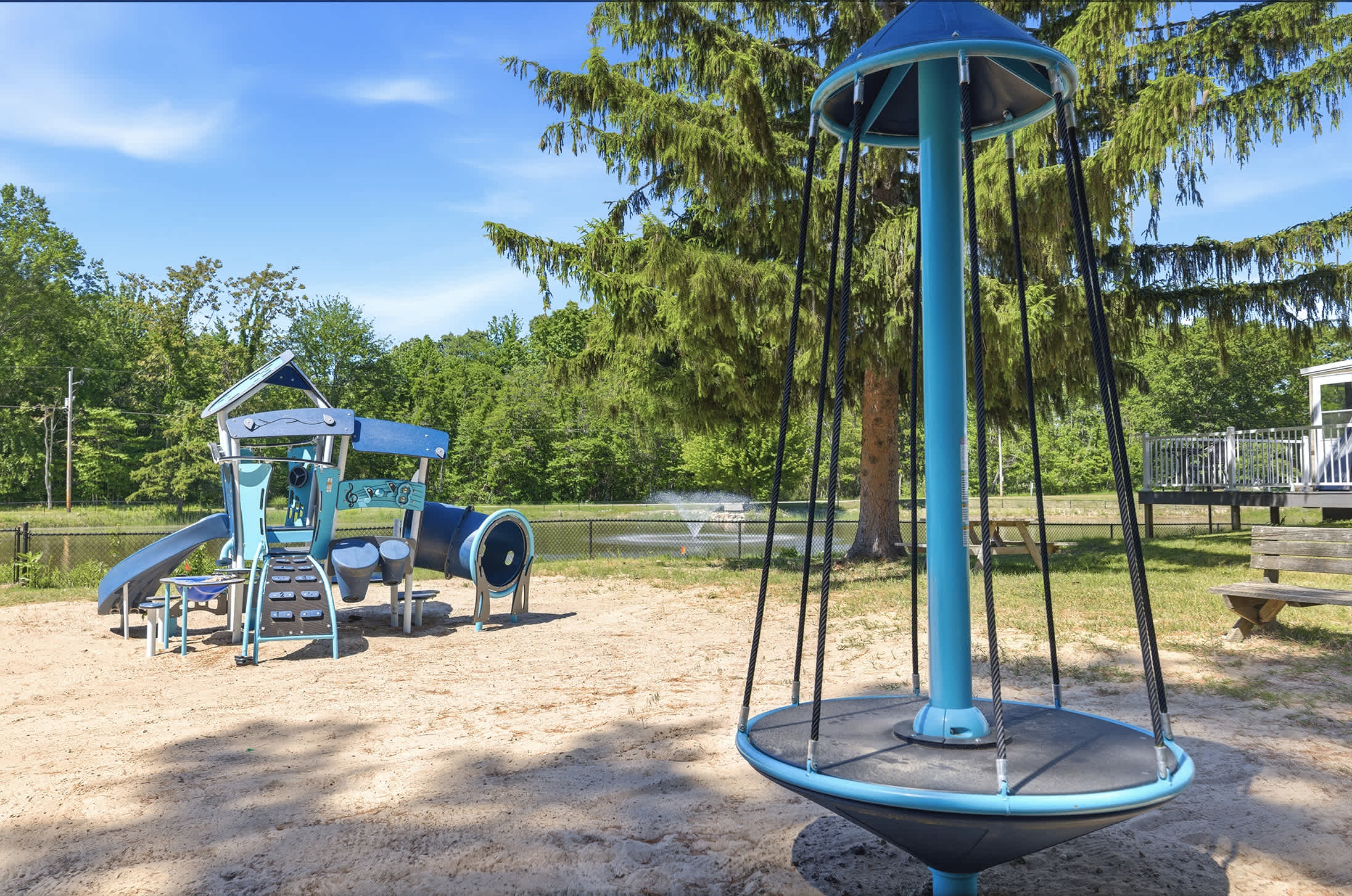 Kids can enjoy their own resort experience with a dedicated playground near the pond, pools, and shared outdoor spaces.