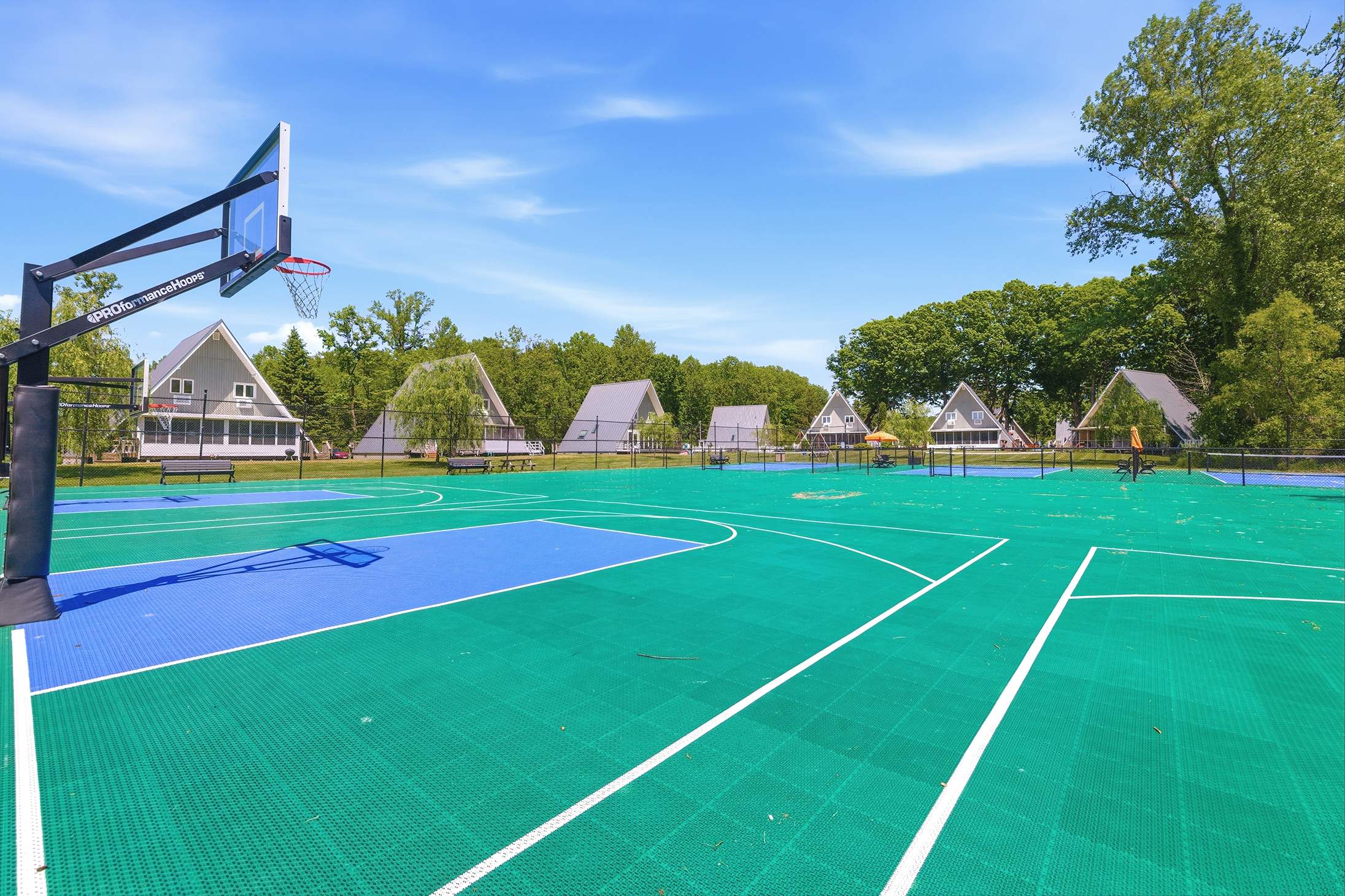 Full basketball and pickleball courts on the resort grounds.