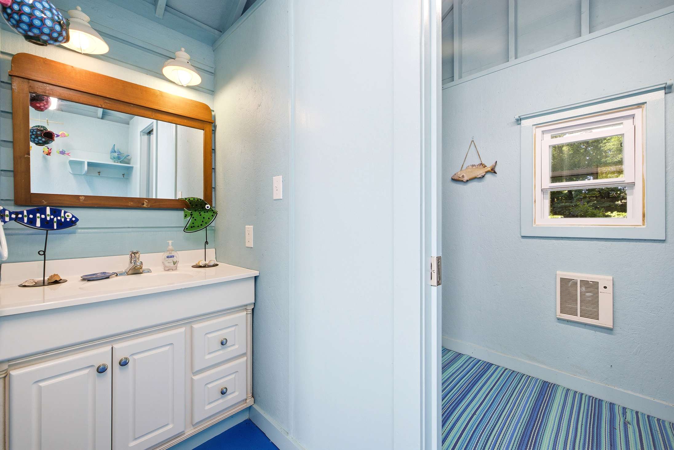 The poolhouse has a convenient bathroom.